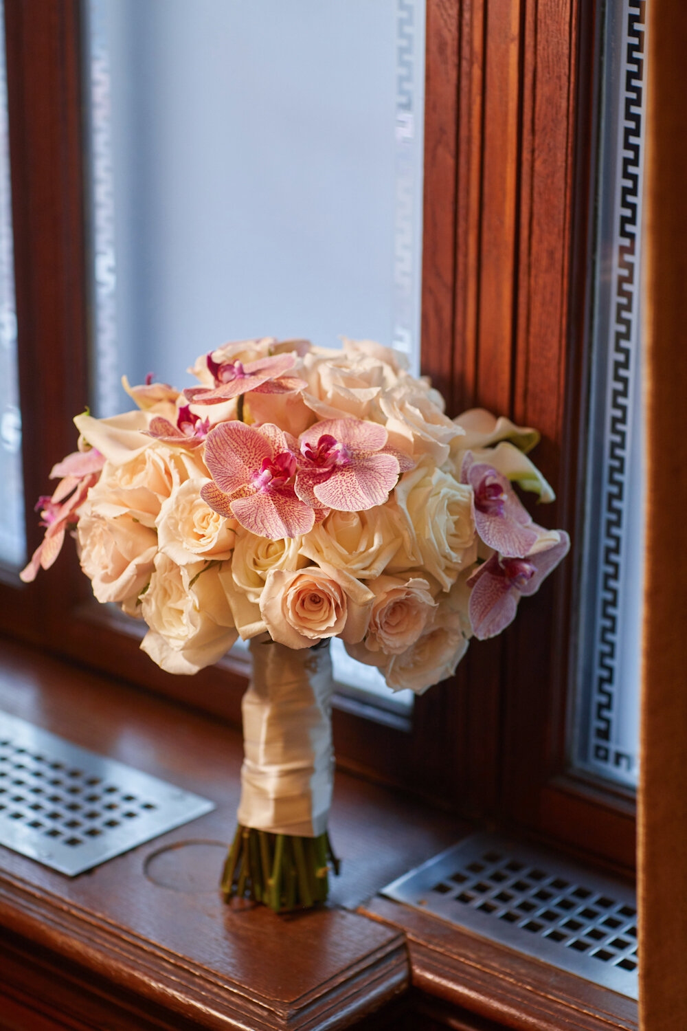 Cipriani 42nd Street Wedding floral bouquet with roses and orchids