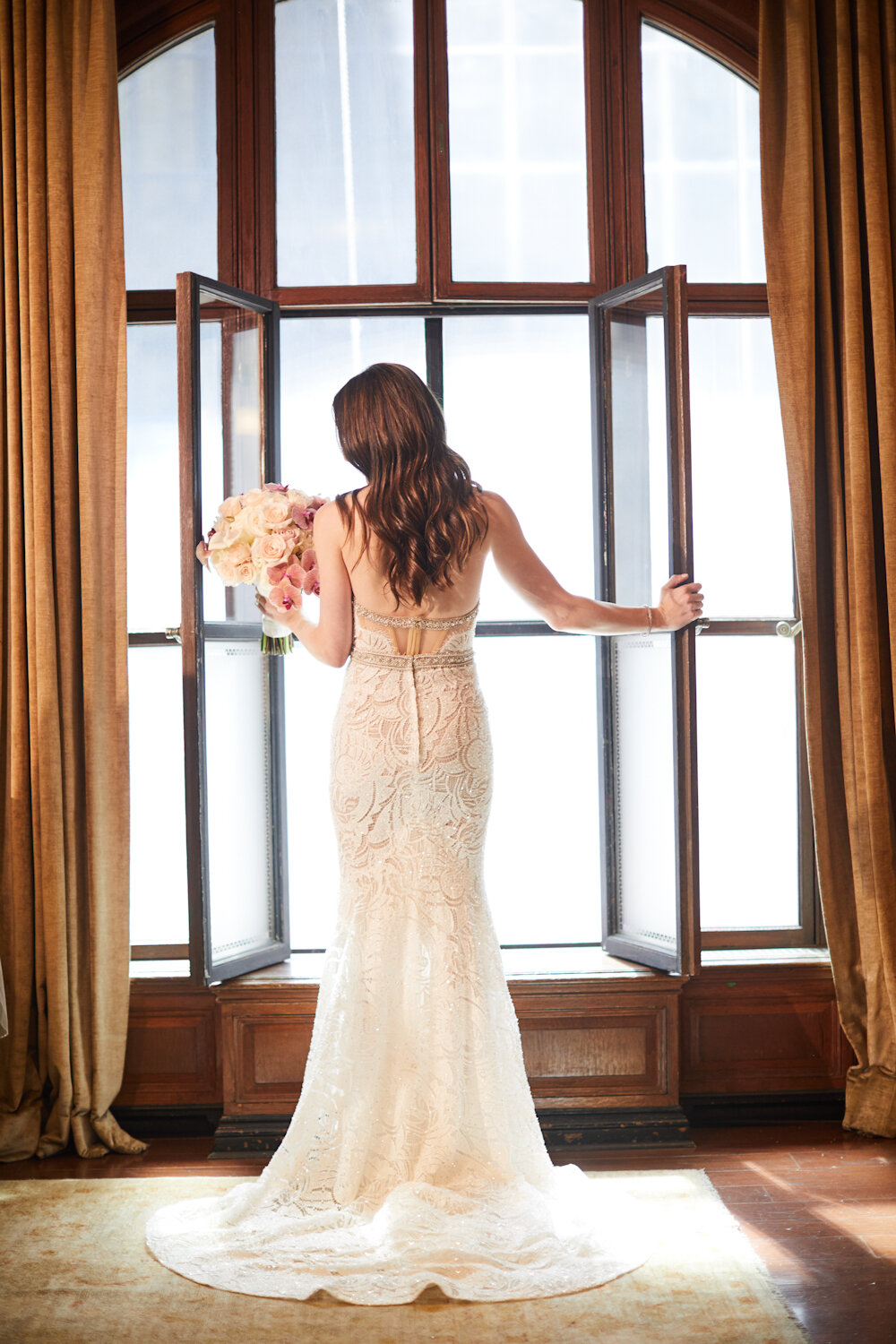 Cipriani 42nd Street Wedding bride holding bouquet wearing Berta Bridal