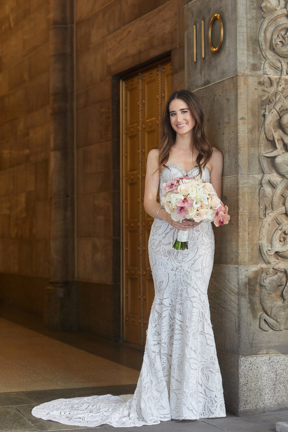 Cipriani 42nd Street Wedding bride in lace gown holding a bouquet