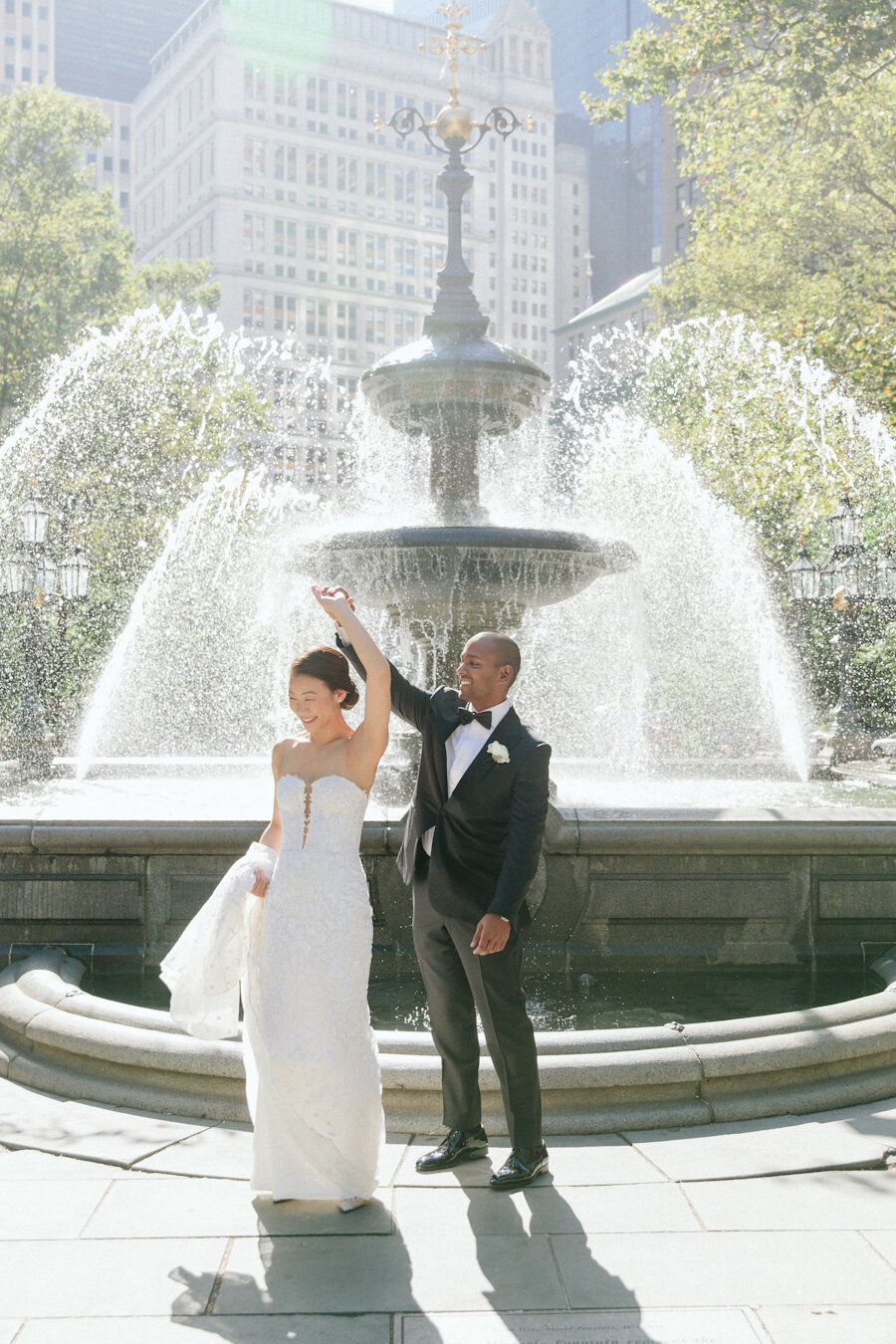 Four Seasons NYC wedding bride and groom in front of fountain