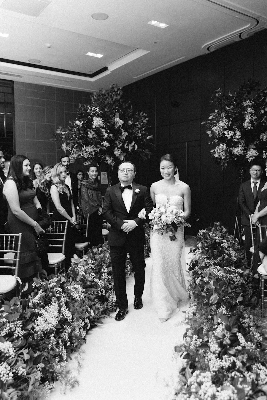 Four Seasons NYC wedding ceremony bride walks down the aisle