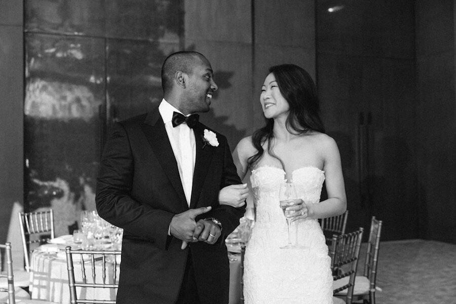 Four Seasons NYC wedding bride and groom see the reception