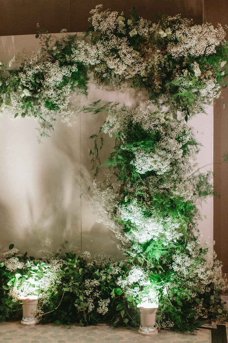 Four Seasons NYC wedding white backdrop with baby's breath