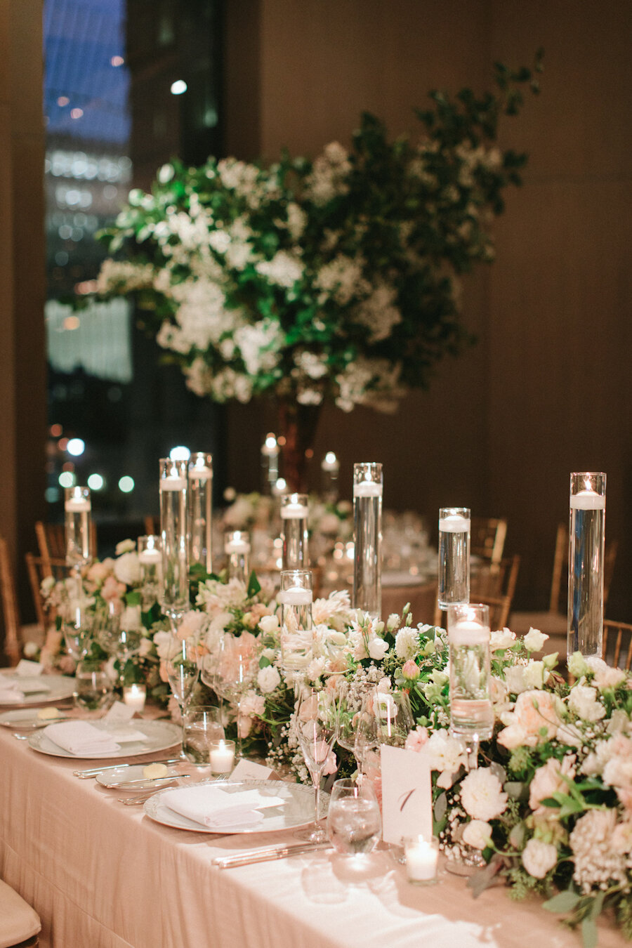 Four Seasons NYC wedding flower garland with floating candles