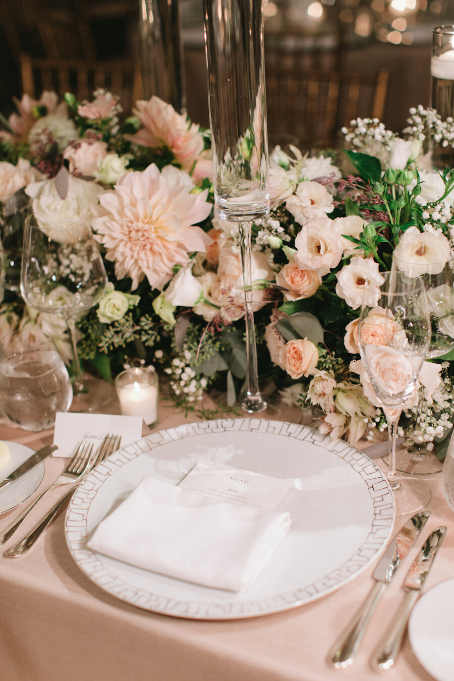 Four Seasons NYC wedding white charger and blush flowers