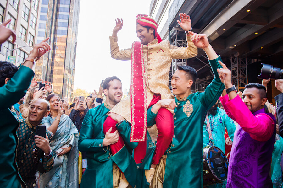 Mandarin Oriental New York wedding baraat groom on groomsmen shoulders