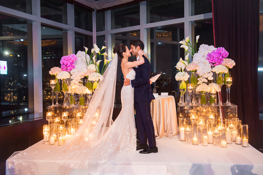 Mandarin Oriental New York wedding ceremony bride and groom kiss