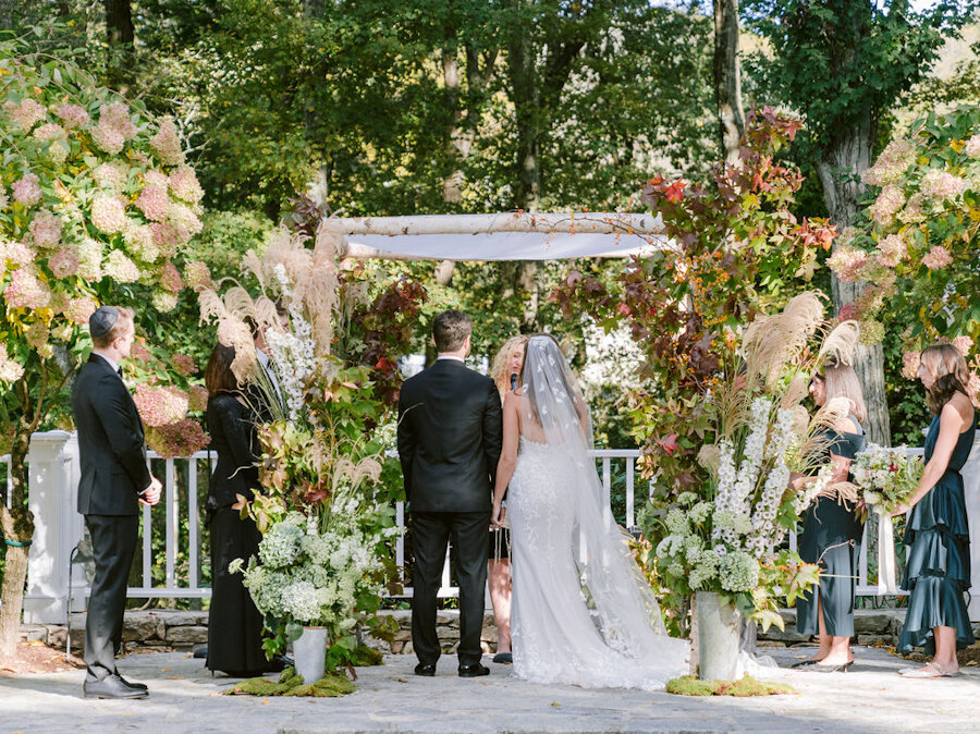 micro wedding bride and groom under the chuppah