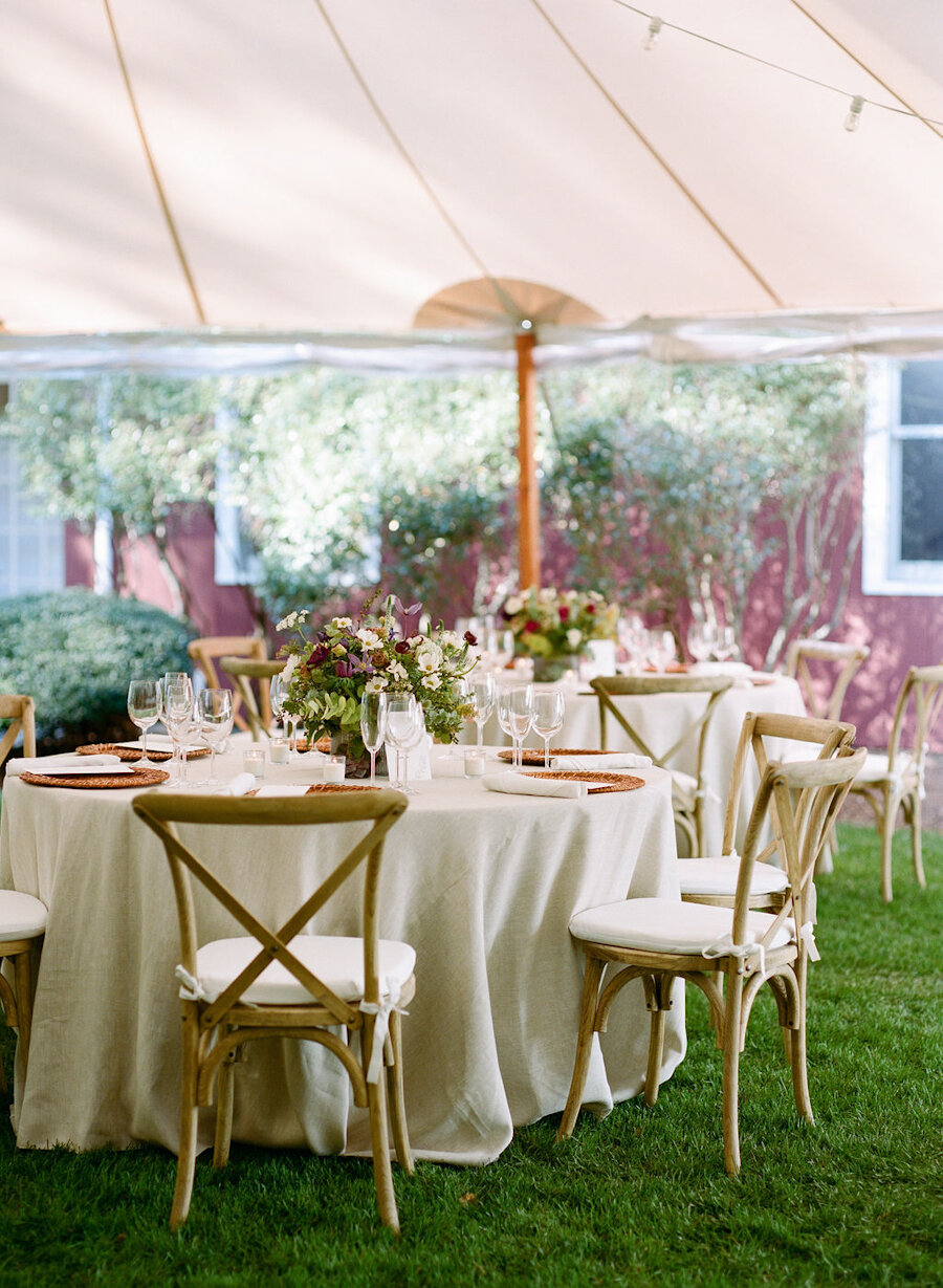 micro wedding tables under a tent
