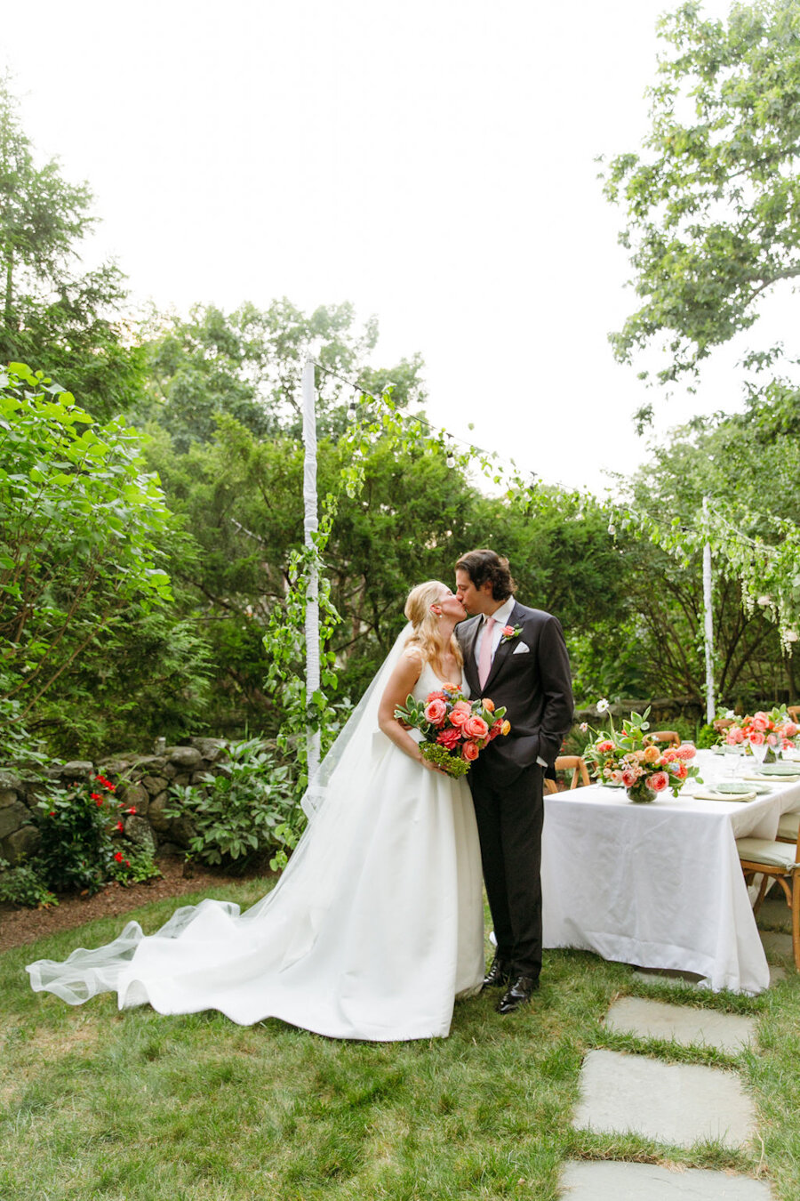 backyard-micro-wedding-bride-groom-kissing.jpg