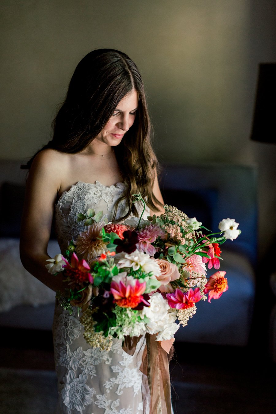 bride holding fall bouquet
