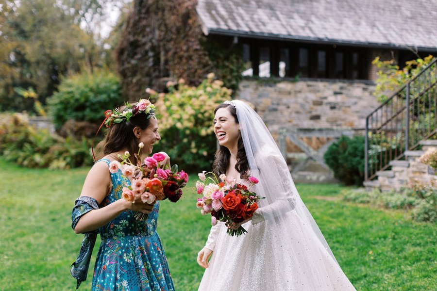blue-hill-at-stone-barns-wedding-bride-bridesmaid-laughing.jpg