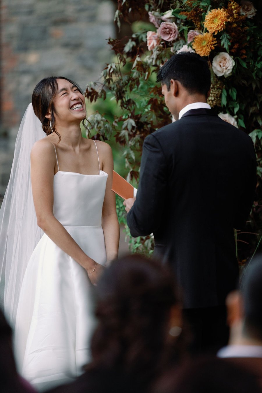 blue-hill-at-stone-barns-wedding-ceremony-bride-laughing.jpg