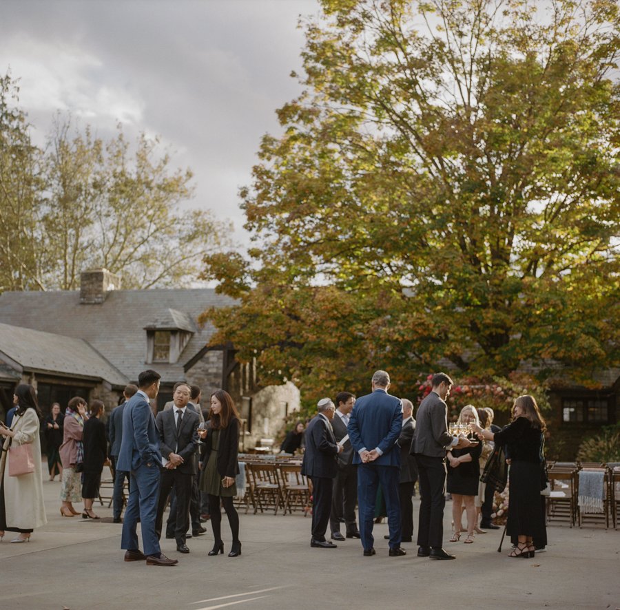 blue-hill-at-stone-barns-wedding-cocktails-guests-courtyard.jpg