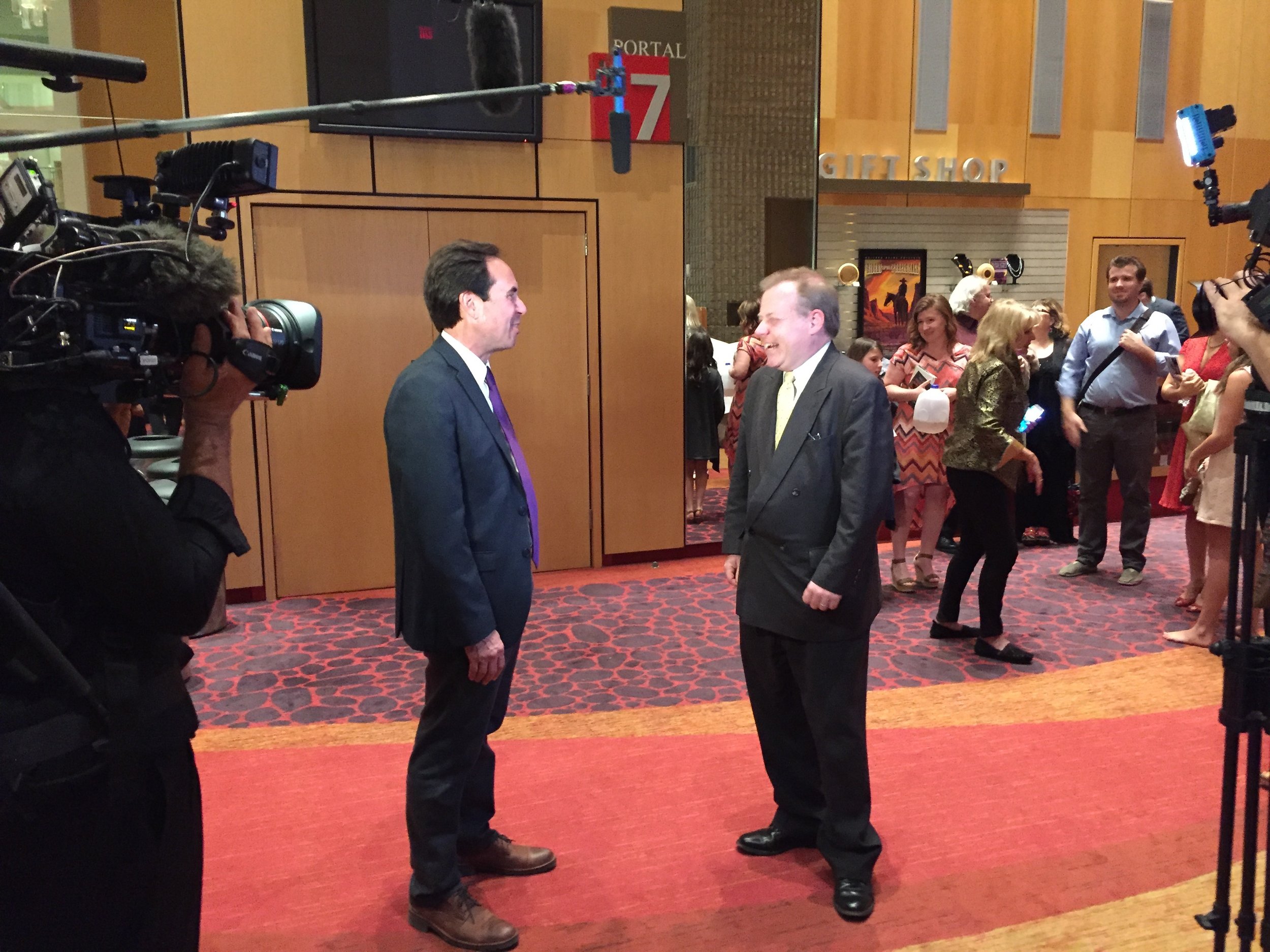 Librettist Steven Mark Kohn talks with an elated Robert Zane Grey after opening night in Phoenix.