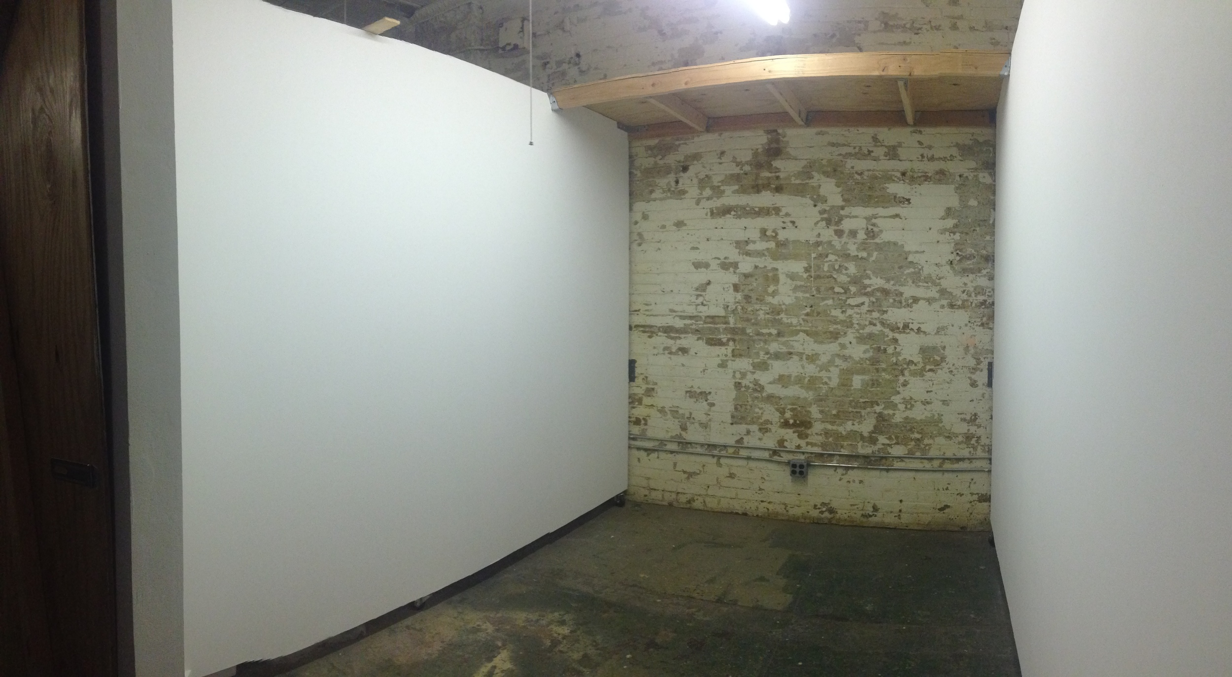 Ground Floor Studio - about 100 square feet, nice white walls reinforced with plywood, and most spaces have a wide shelf.