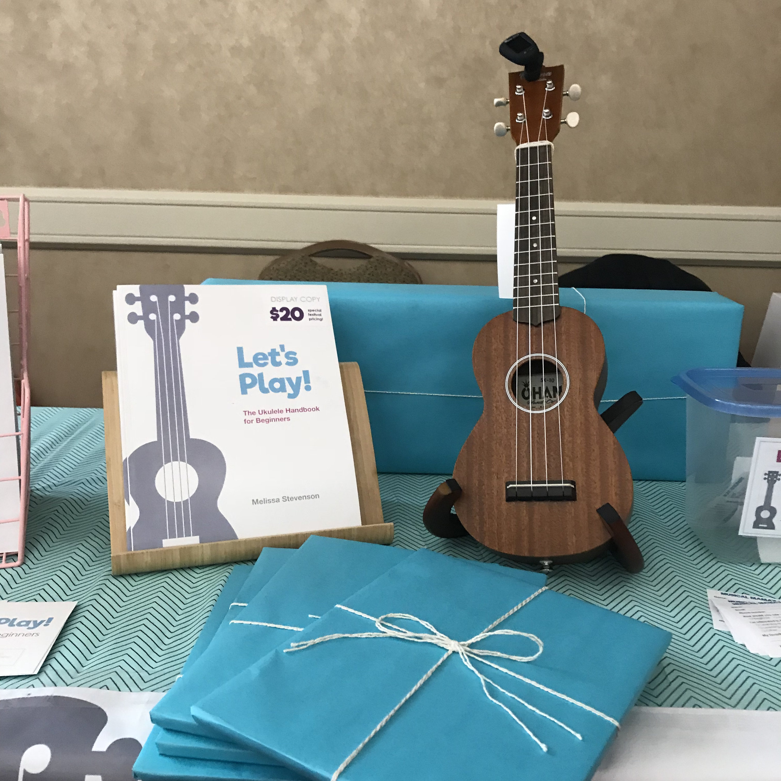 Gift-wrapped books and Ohana ukulele