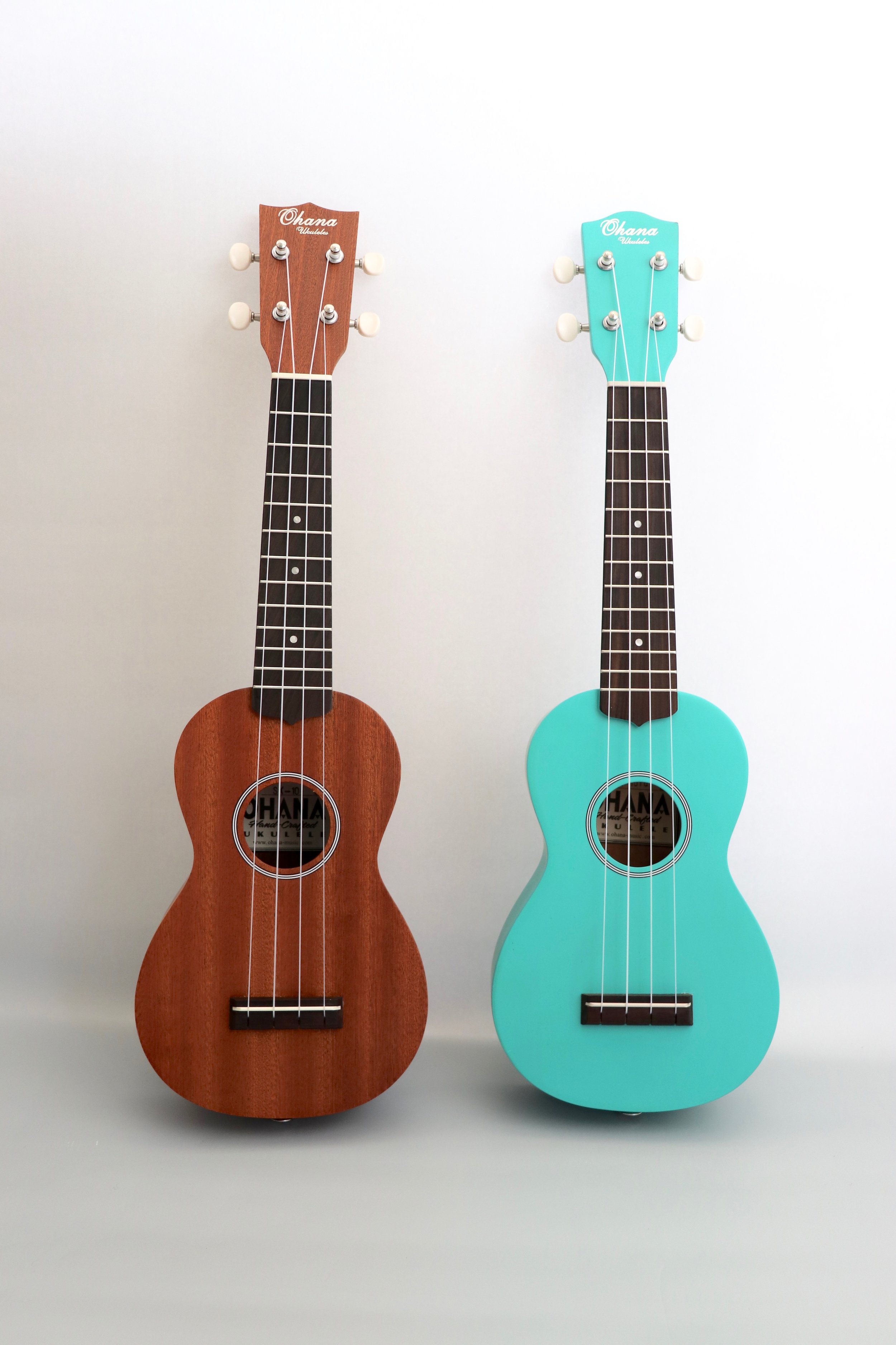 The Ohana SK-10 ukulele starter kits , available in wood tone and turquoise