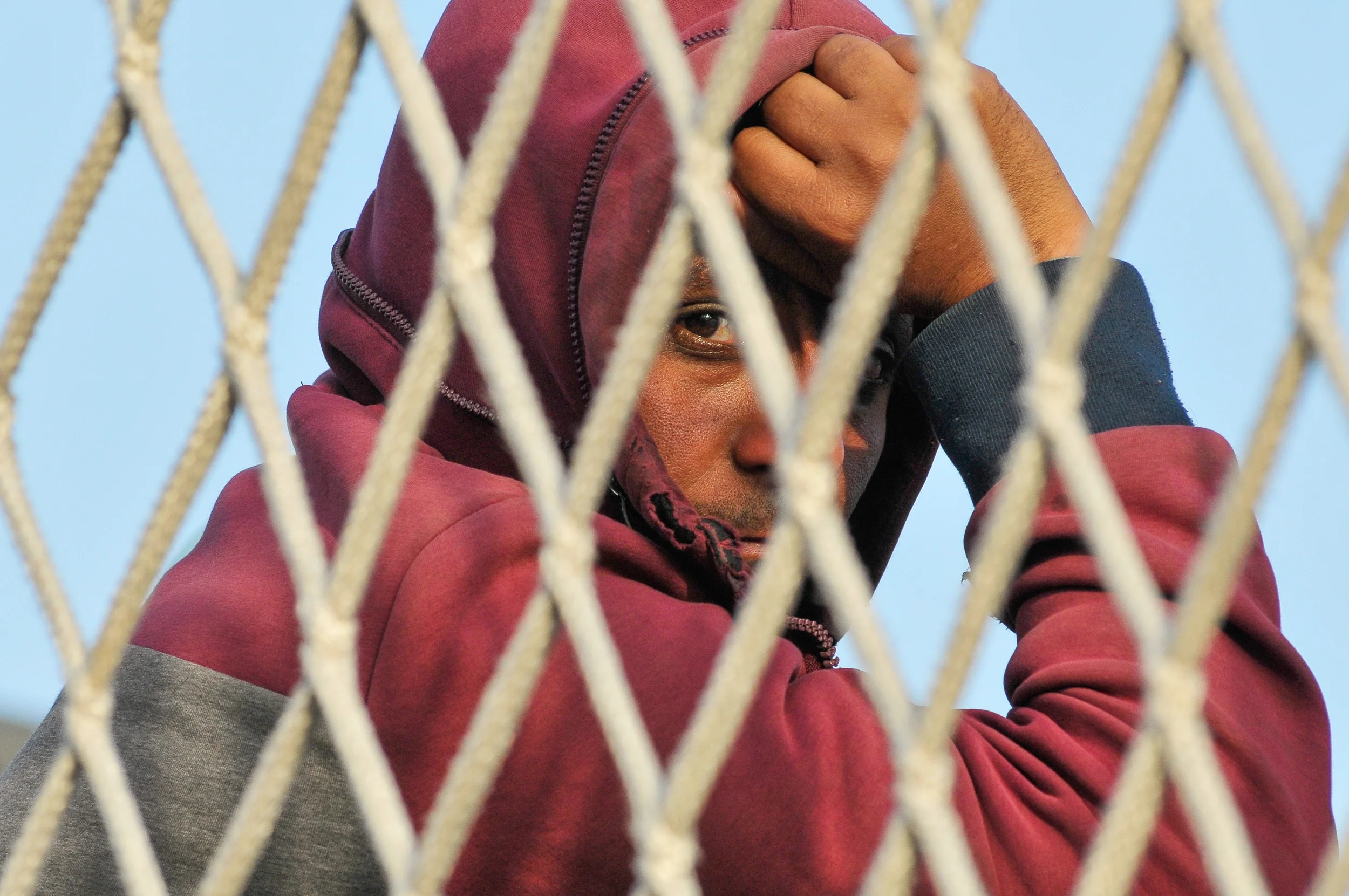 A migrant waits to disembark from the Italian navy ship Borsini in the Sicilian harbour of Palermo, Italy May 5, 2015.