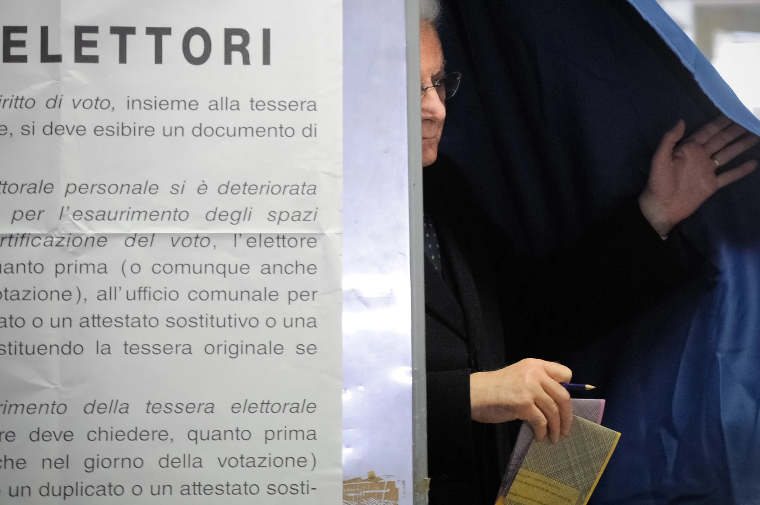 Italian President Sergio Mattarella casts his vote at a polling station in Palermo, Italy, March 4, 2018.