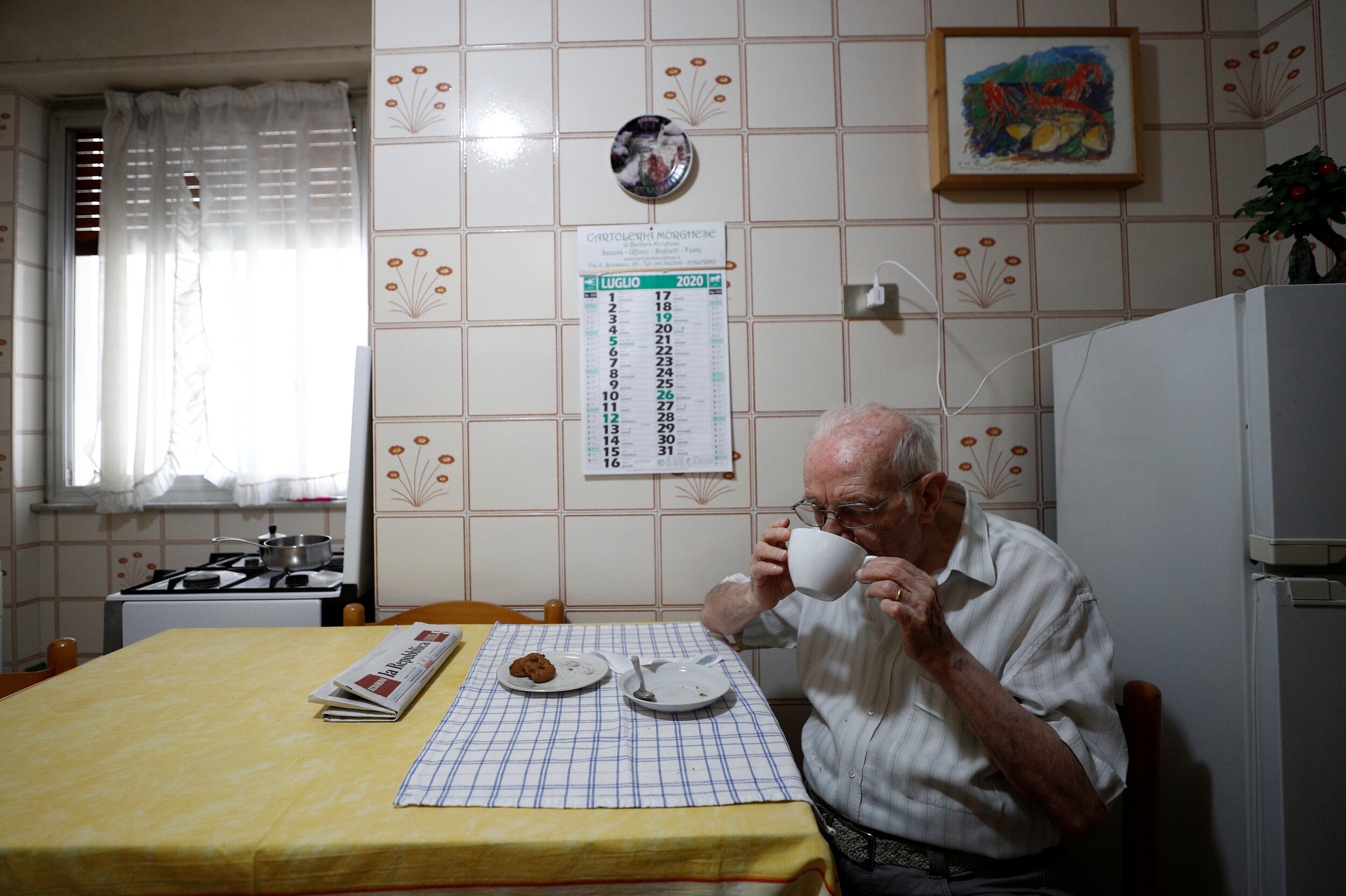  Giuseppe Paterno, 96, Italy's oldest student, has breakfast in his kitchen, two days before he graduates from The University of Palermo with an undergraduate degree in history and philosophy, at his home in Palermo, Italy, July 27, 2020. 