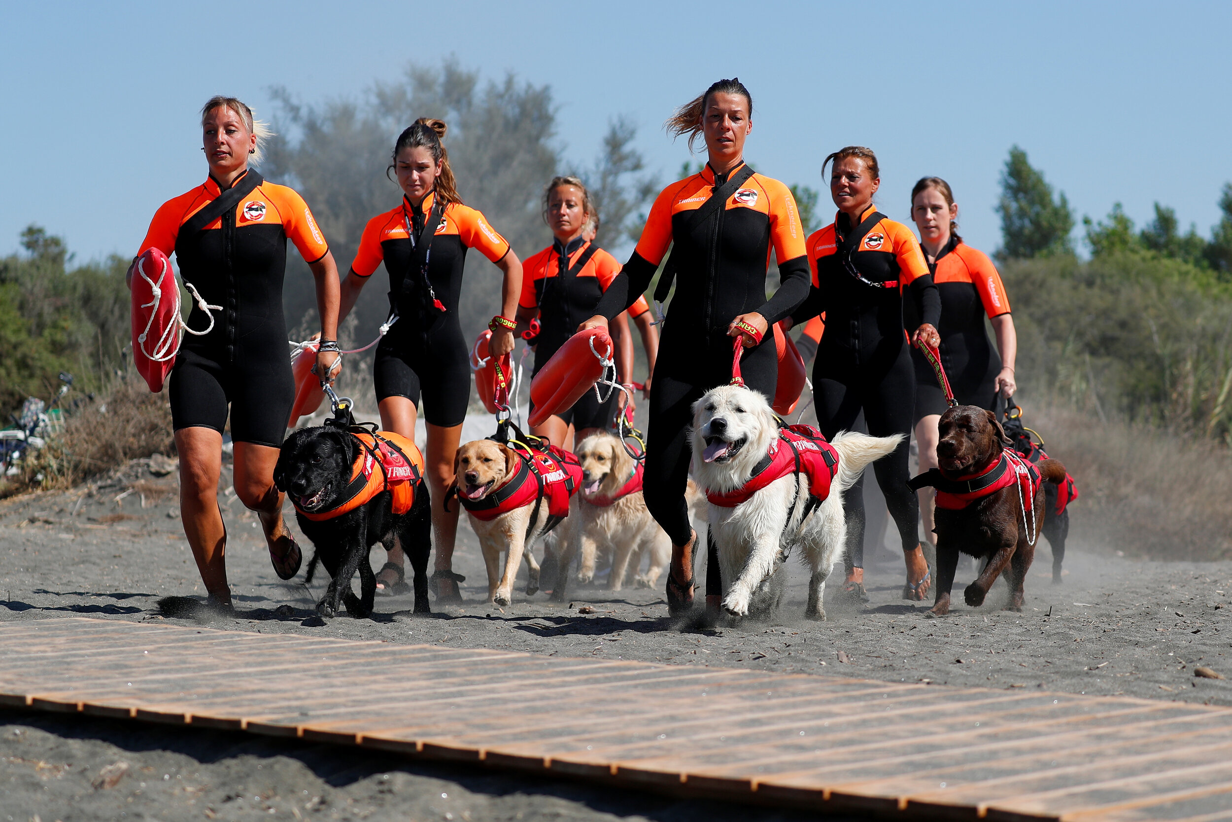  An all-female group of canine rescuers from the Italian School of Rescue Dogs attend a training session before patrolling the beach to ensure swimmers can enjoy their time at the sea in safety, in Riva dei Tarquini, near Rome, Italy, August 25, 2020