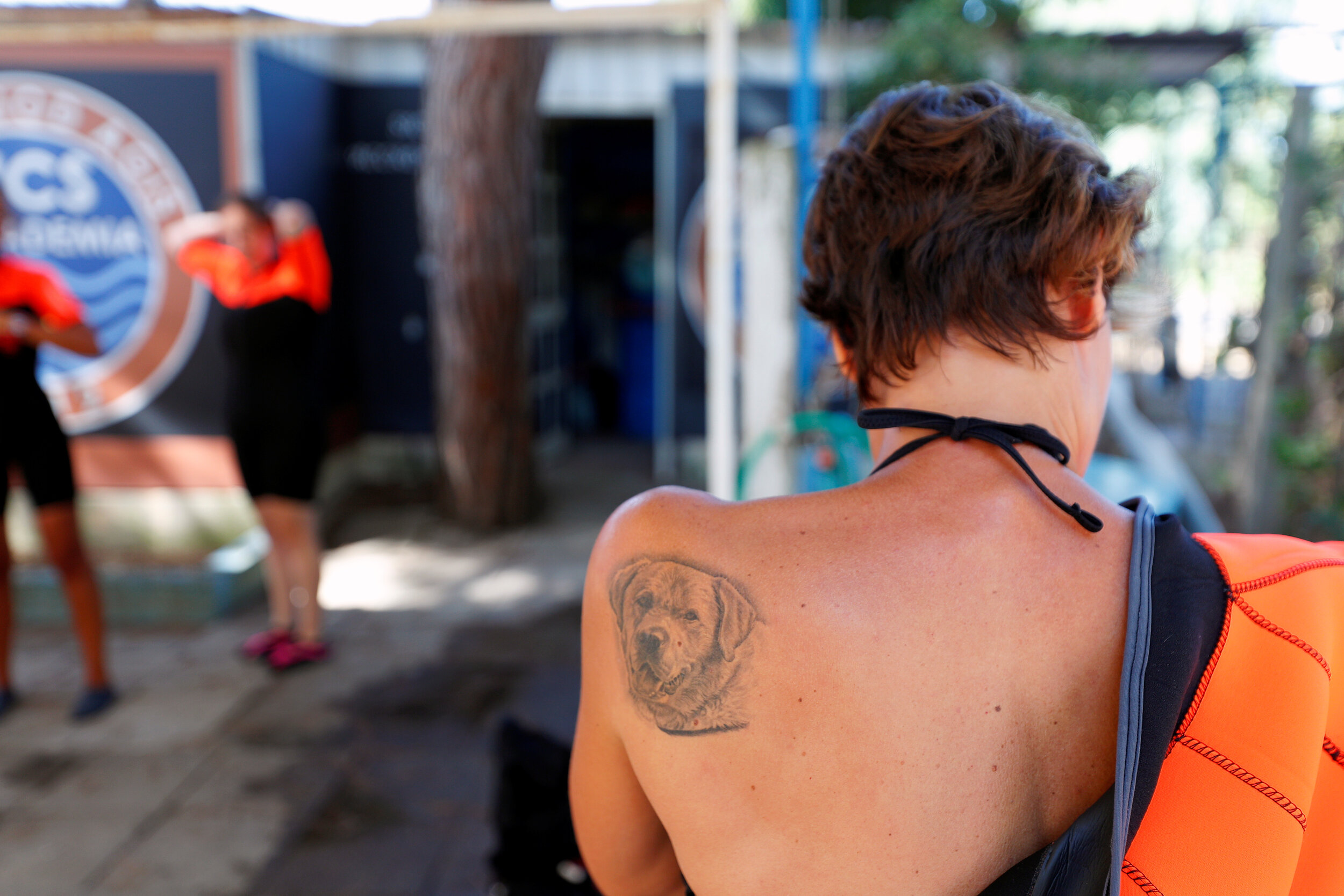  A tattoo in pictured on the shoulder of a member of an all-female group of canine rescuers from the Italian School of Rescue Dogs (La Scuola Italiana Cani Salvataggio) as she gets ready to attend a training session with her dog before patrolling the