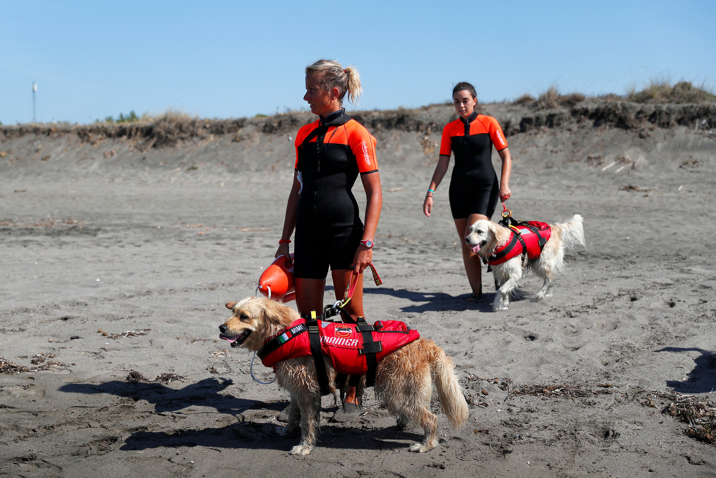  Members of an all-female group of canine rescuers from the Italian School of Rescue Dogs (La Scuola Italiana Cani Salvataggio) attend a training session with their dogs before patrolling the beach to ensure swimmers can enjoy their time at the sea i