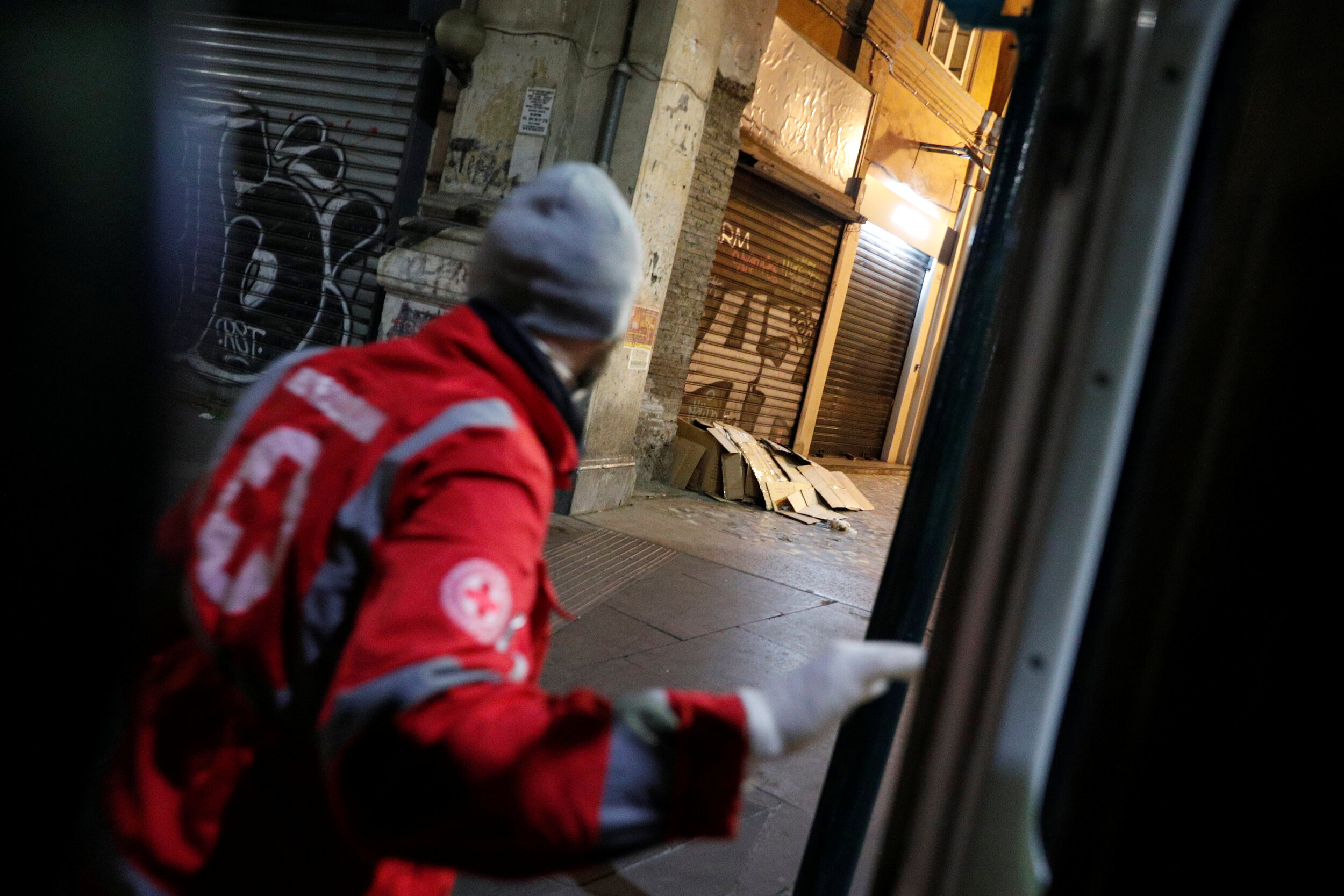  Red Cross worker Giorgio Vacirca, 43, gets out of a van after spotting a homeless person in Rome, Italy, March 17, 2020. Since the coronavirus crisis, Red Cross workers have been increasing their daily activities to meet the growing needs of the hom