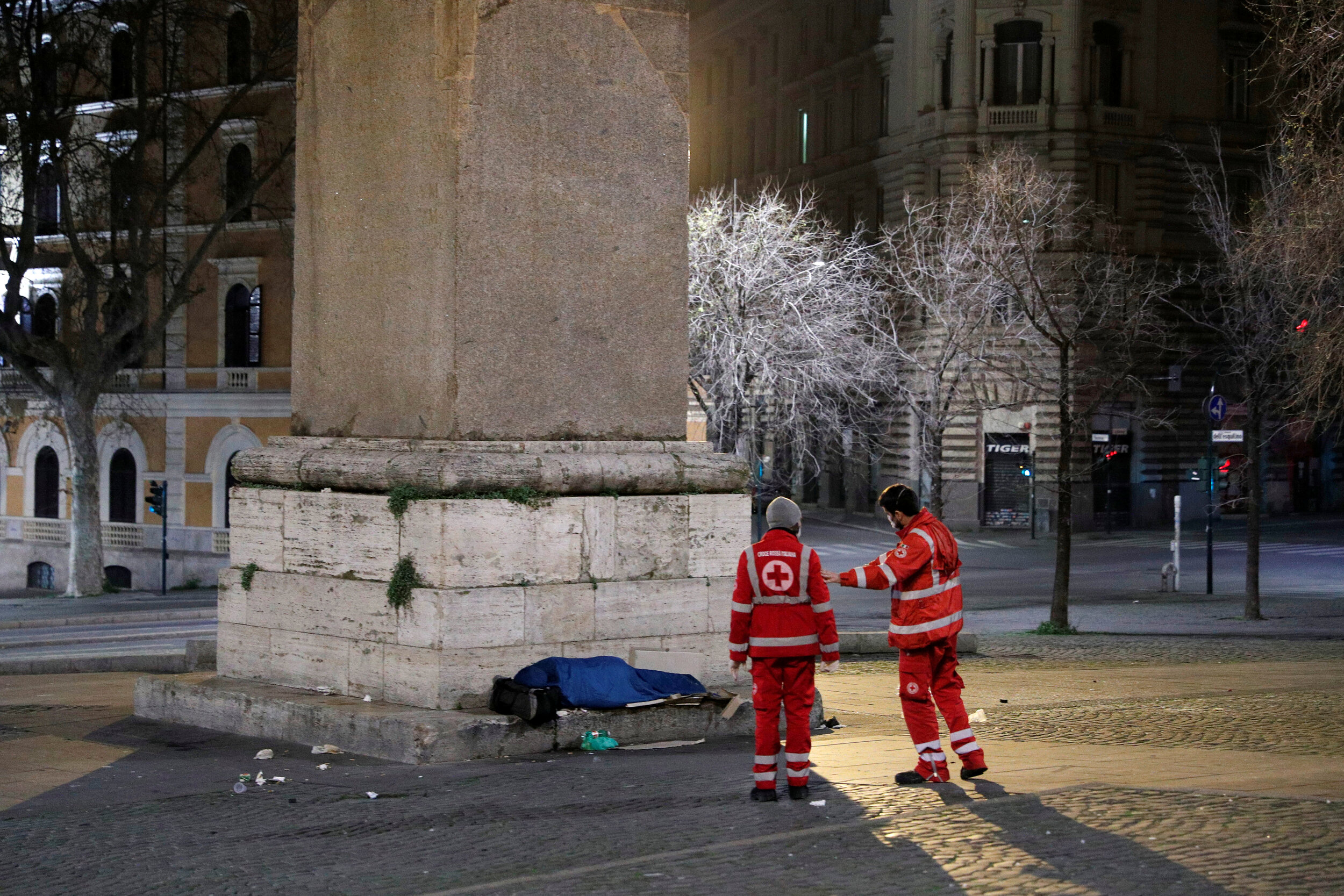  Red Cross workers check on a homeless person sleeping on the street in Rome, Italy, March 17, 2020. Since the coronavirus crisis, Red Cross workers have been increasing their daily activities to meet the growing needs of the homeless in Rome. 