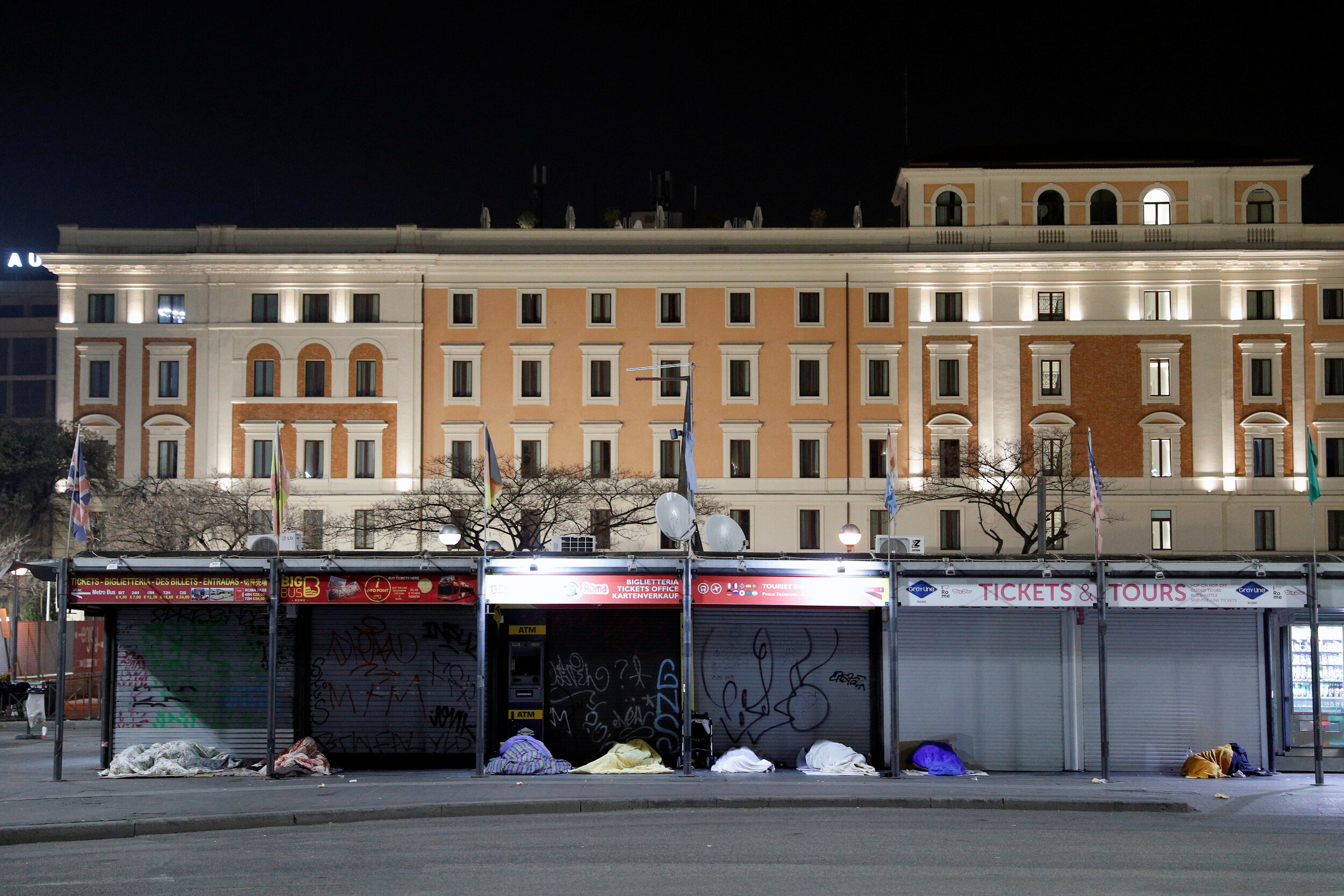  Homeless people sleep on a street in Rome, Italy, March 17, 2020. Since the coronavirus crisis, Red Cross workers have been increasing their daily activities to meet the growing needs of the homeless in Rome. 