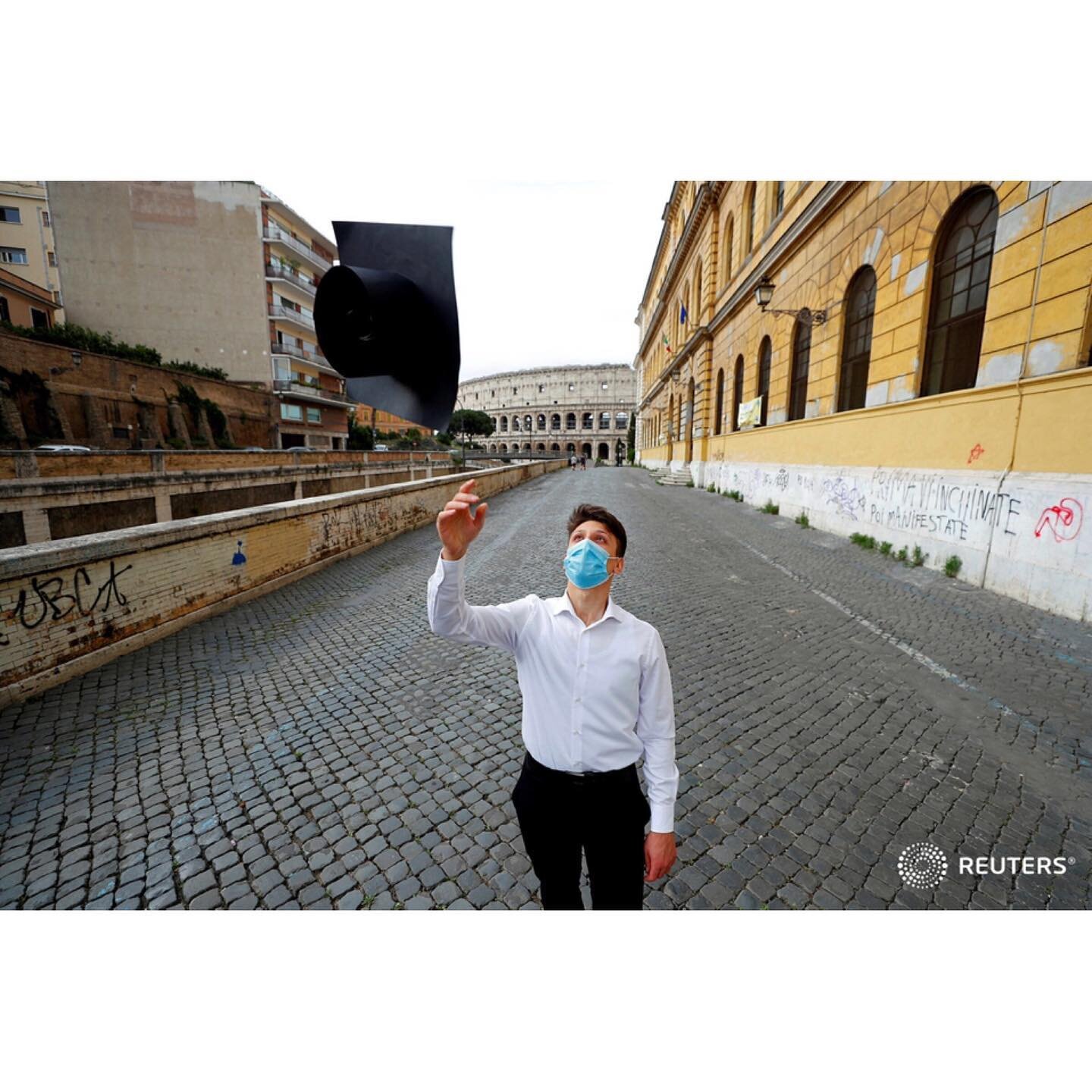 A student wearing a protective face mask celebrates after taking his final exams under strict regulations in post-lockdown Italy, following the coronavirus disease (COVID-19) outbreak, in front of the Colosseum in Rome, Italy June 17, 2020.
.
.
.
.
.