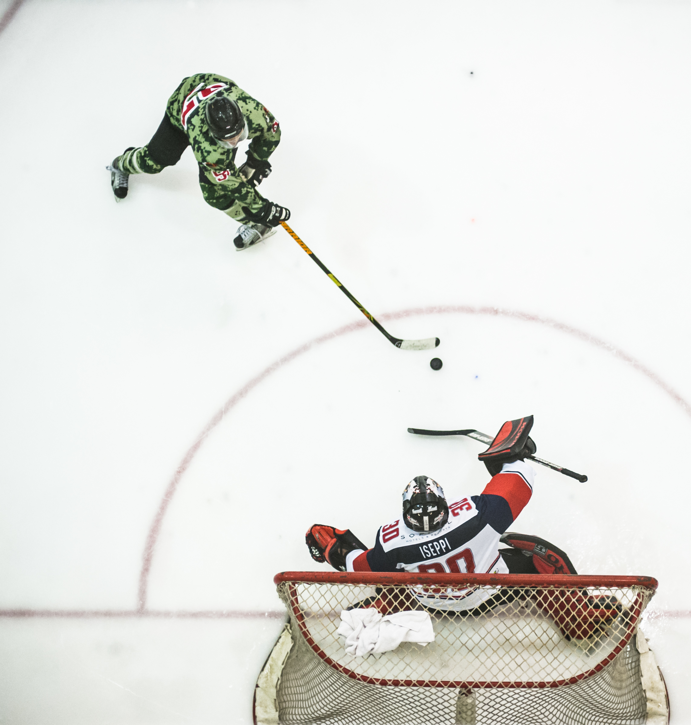 A goal keeper and player face off during the Lion City Cup at the Rink.