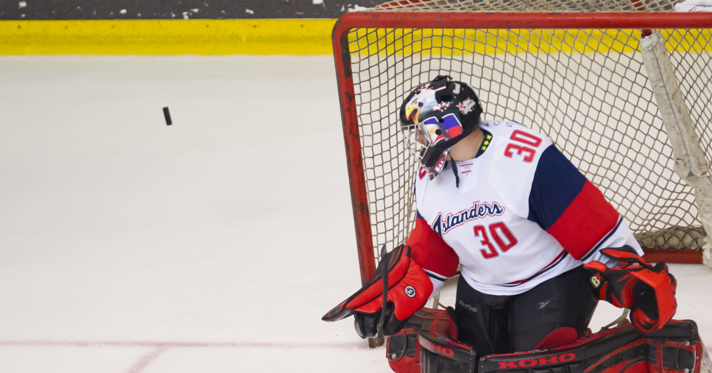 A Filipino goal keeper stares at an approaching puck during the Lion City Cup at the Rink.