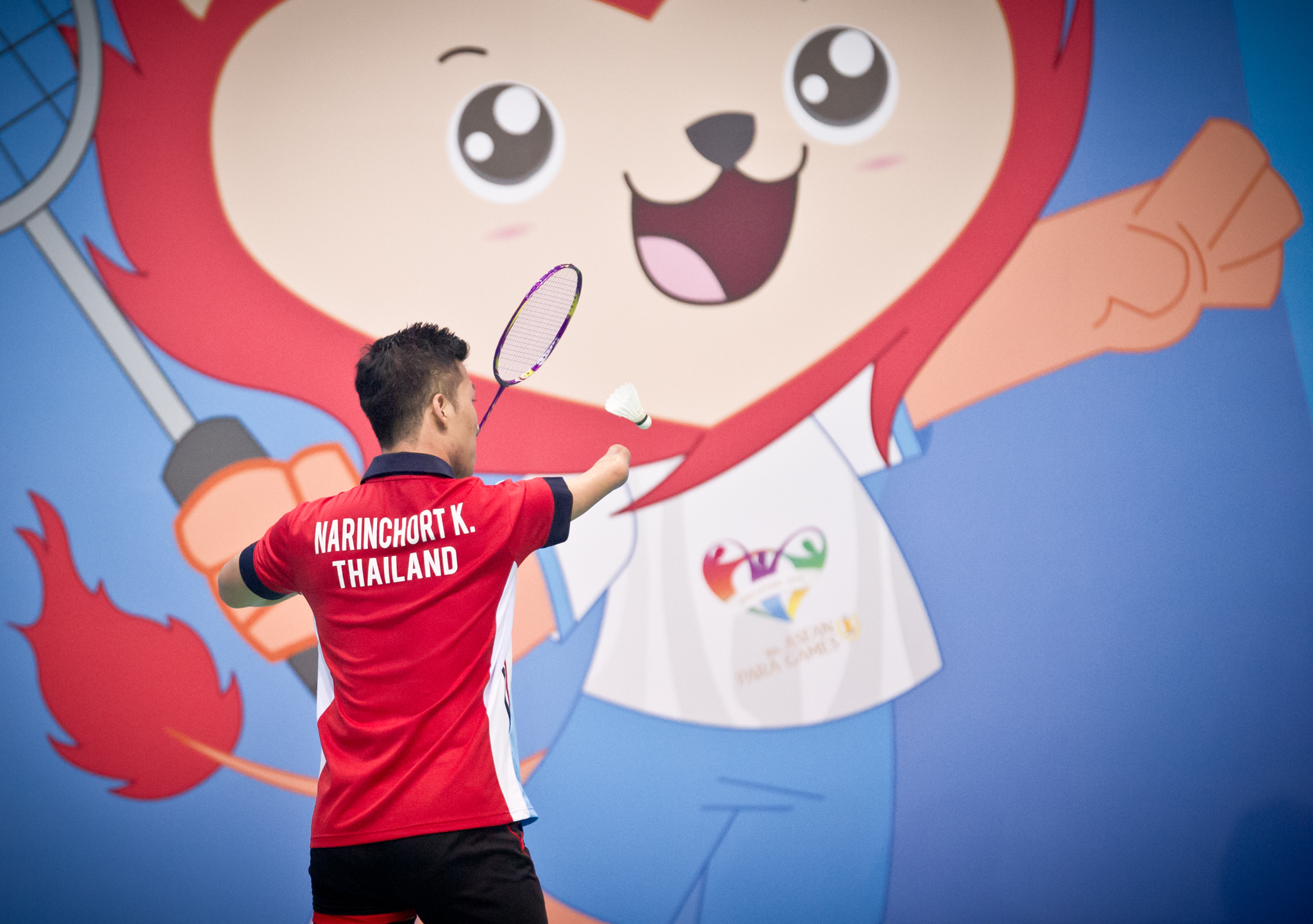 A Thai para-badminton player serves during the ASEAN Para Games at the OCBC Arena.