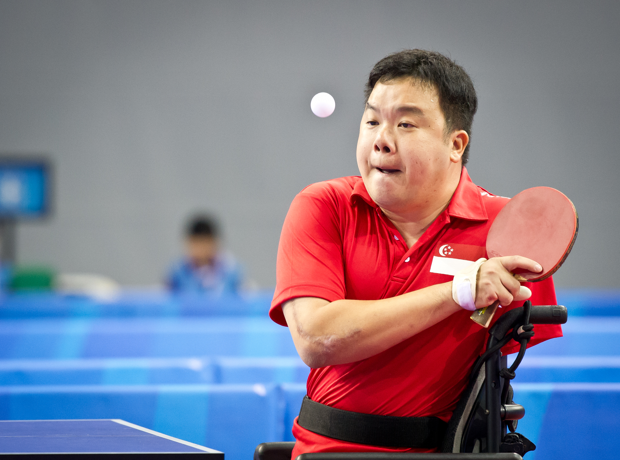 A para-table tennis player prepares to return the ball during the ASEAN Para Games at the OCBC Arena.