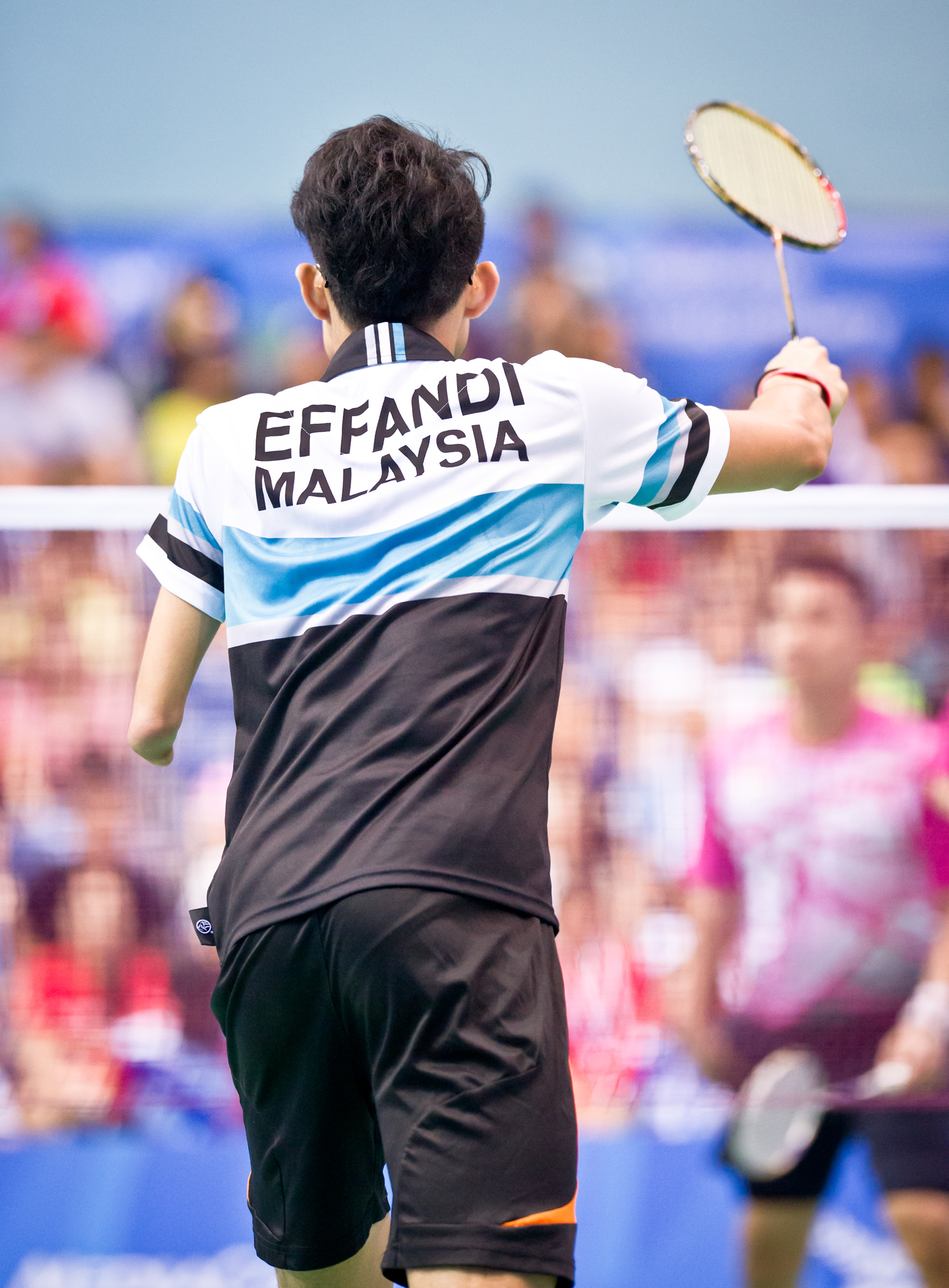 A Malaysian para-badminton player prepares to receive a serve during the ASEAN Para Games at the OCBC Arena.