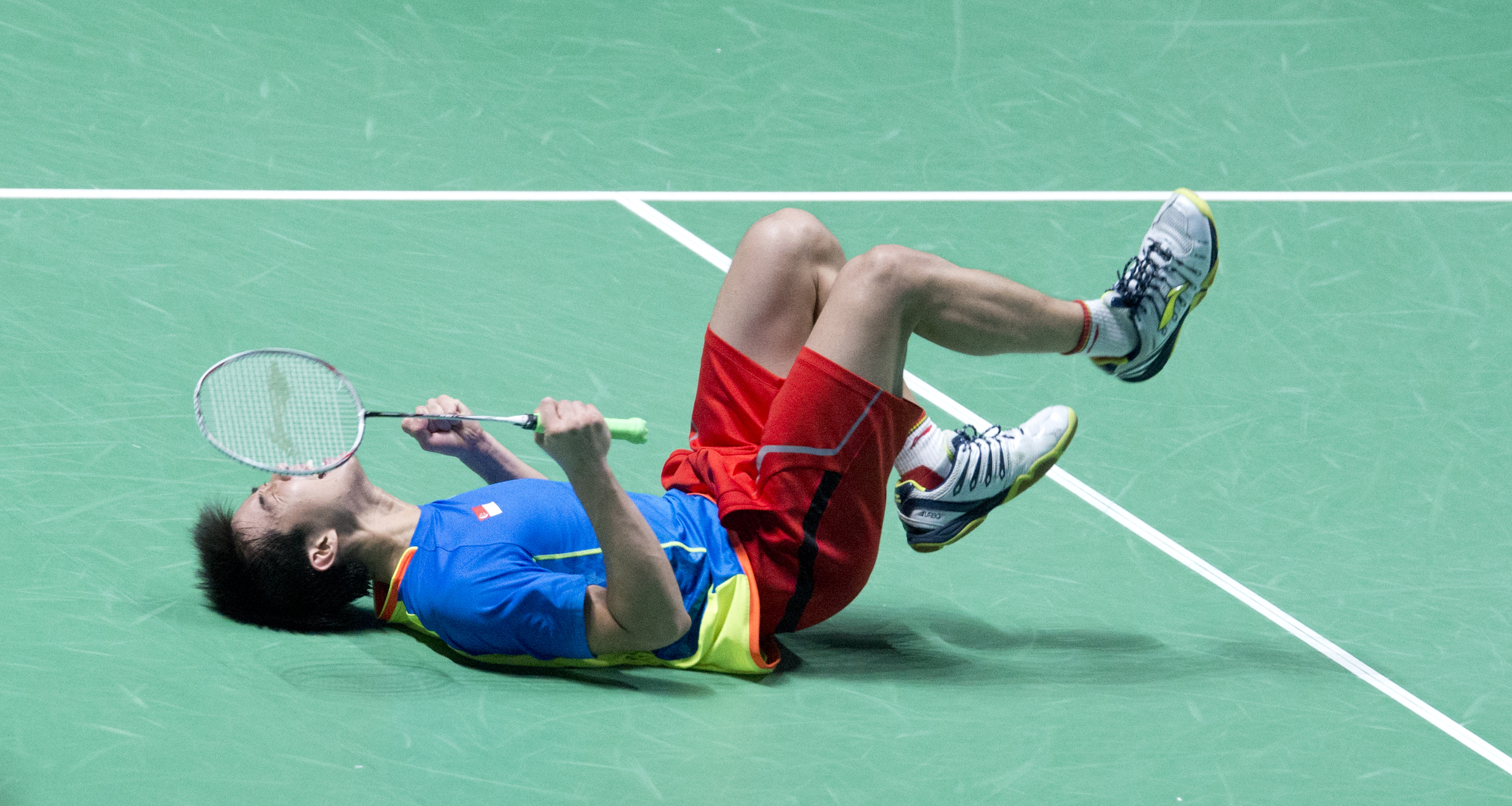 A Singaporean badminton player celebrating during the SEA Games at the Singapore Indoor Stadium.