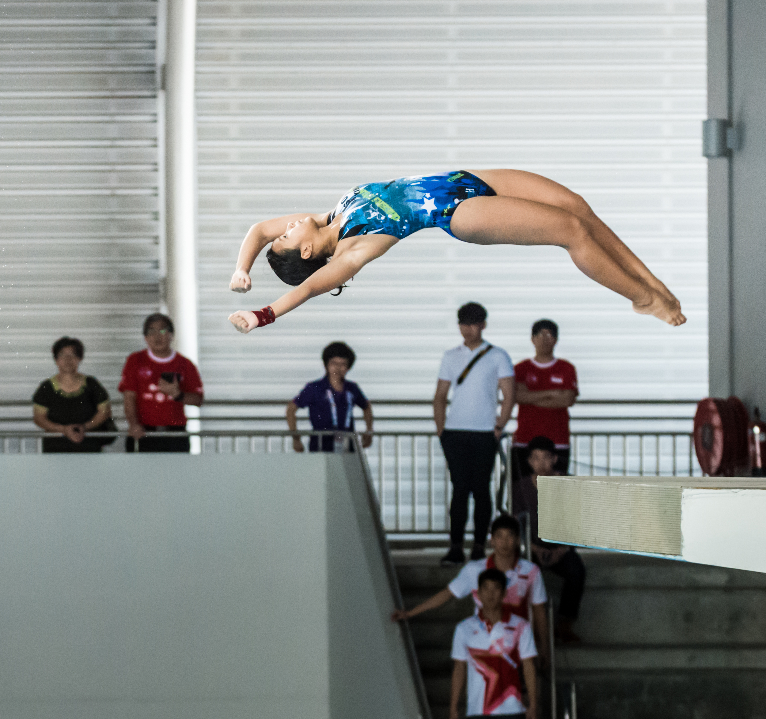 A Malaysian diver jumps off the 10m platform during the SEA Games at the OCBC Aquatic Centre.