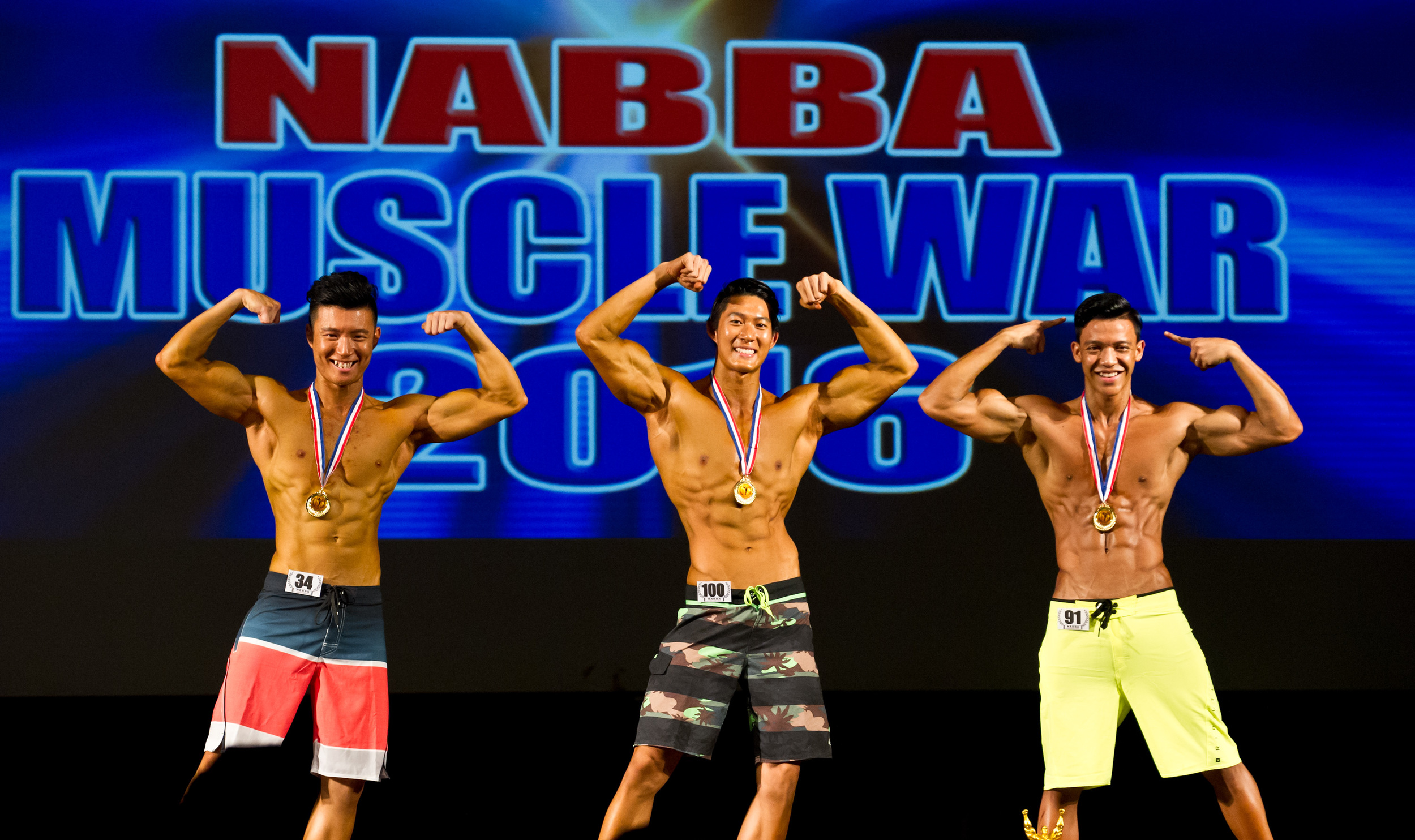 Winners of the fitness category pose with their medals during the NABBA Muscle War competition at Scape.