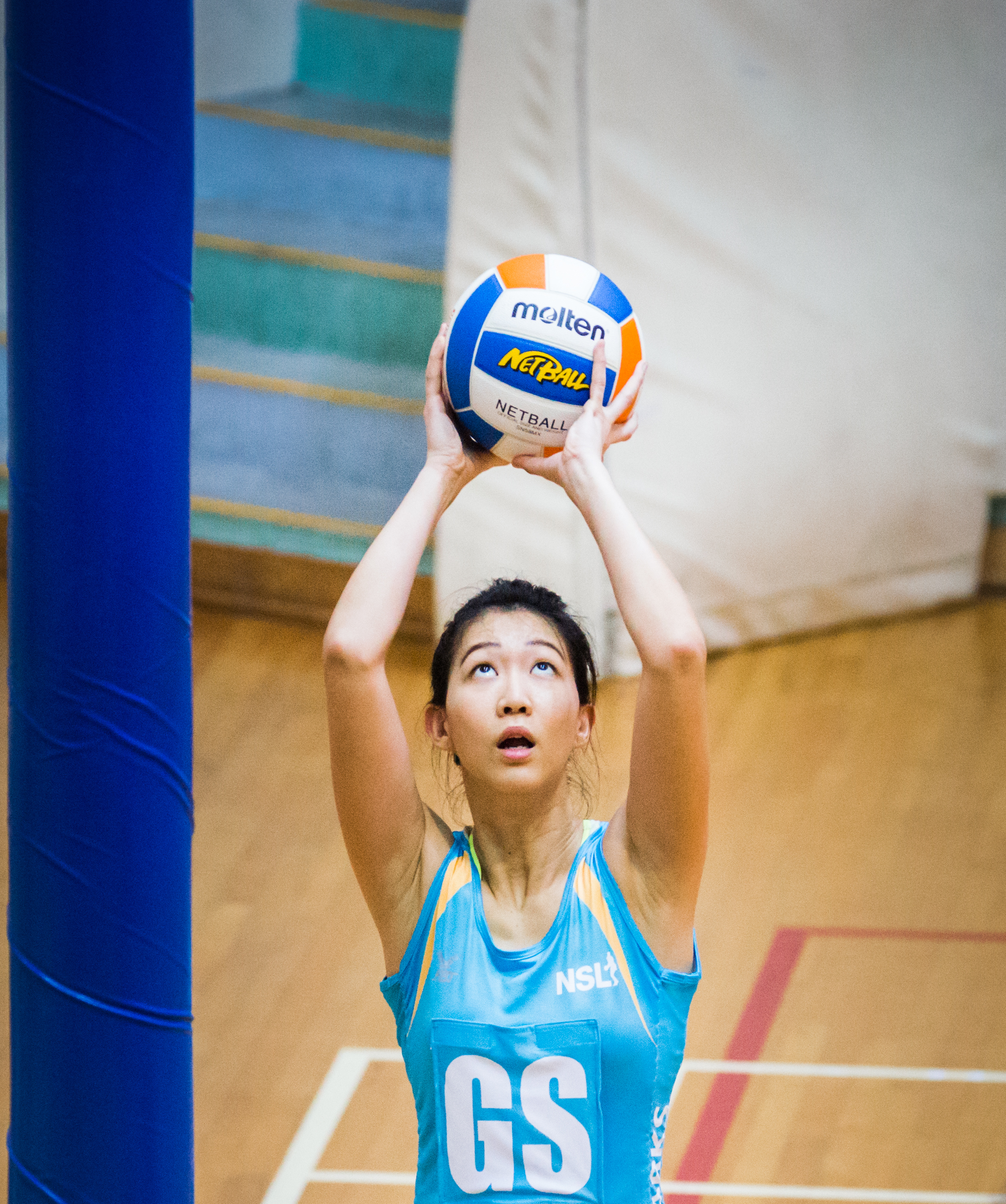 A netballer prepares to score during a Netball Super League match at the Toa Payoh Sports Hall.