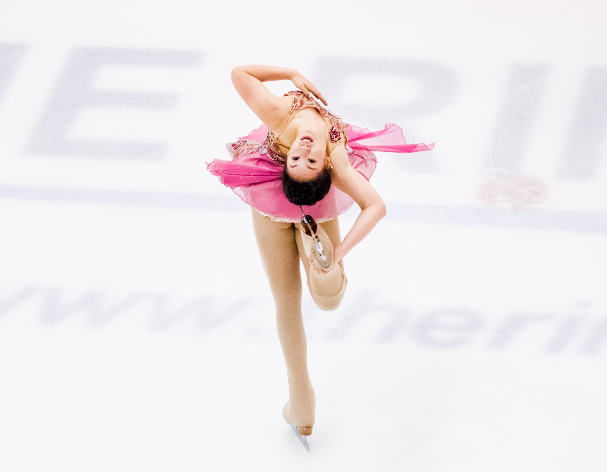 A Singaporean figure skater executes a spin during the Singapore National Championships at the Rink.
