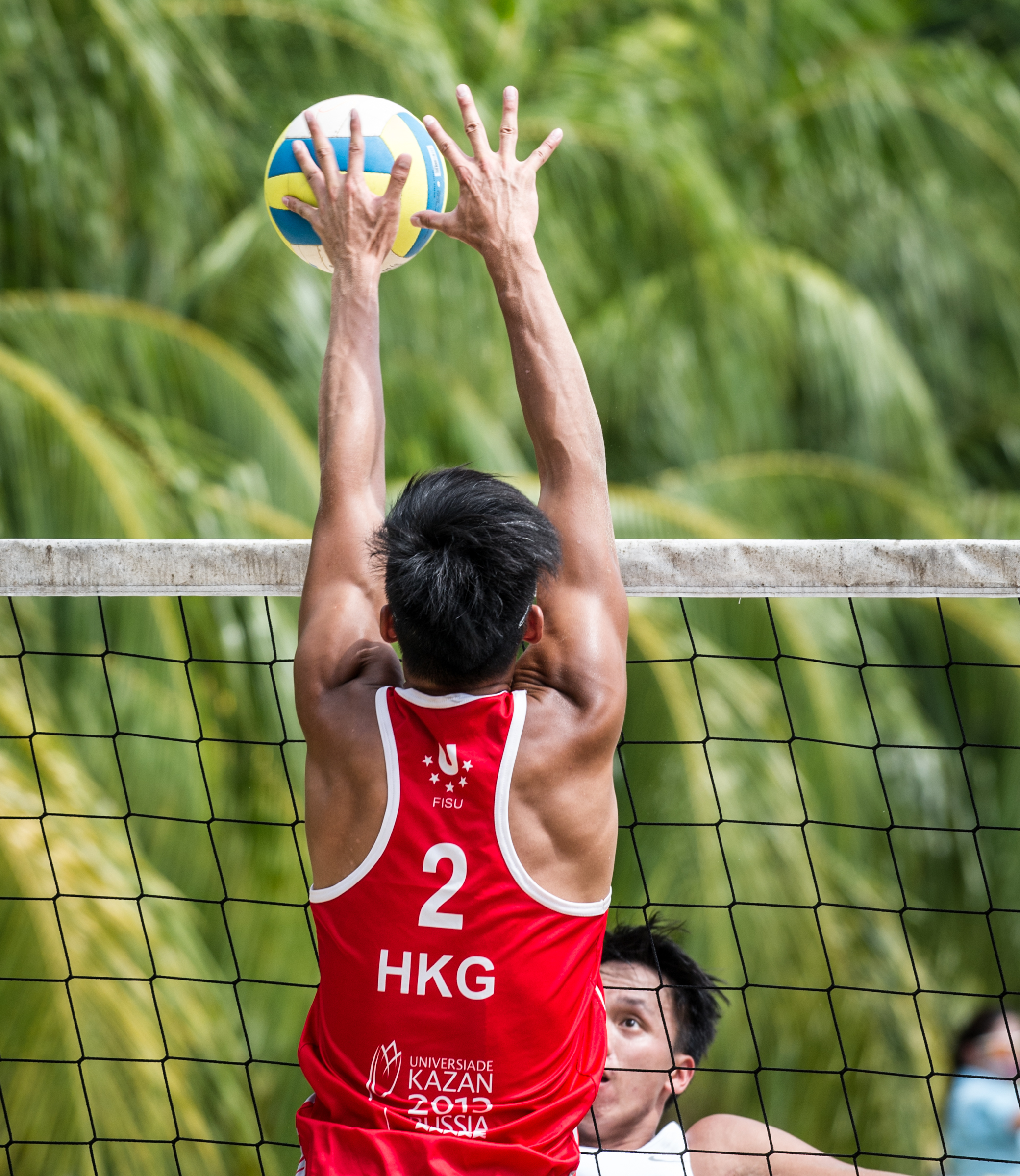 A Hong Kong player blocks a shot during the Beach Volleyball National Series at the Yio Chu Kang Swimming Complex.