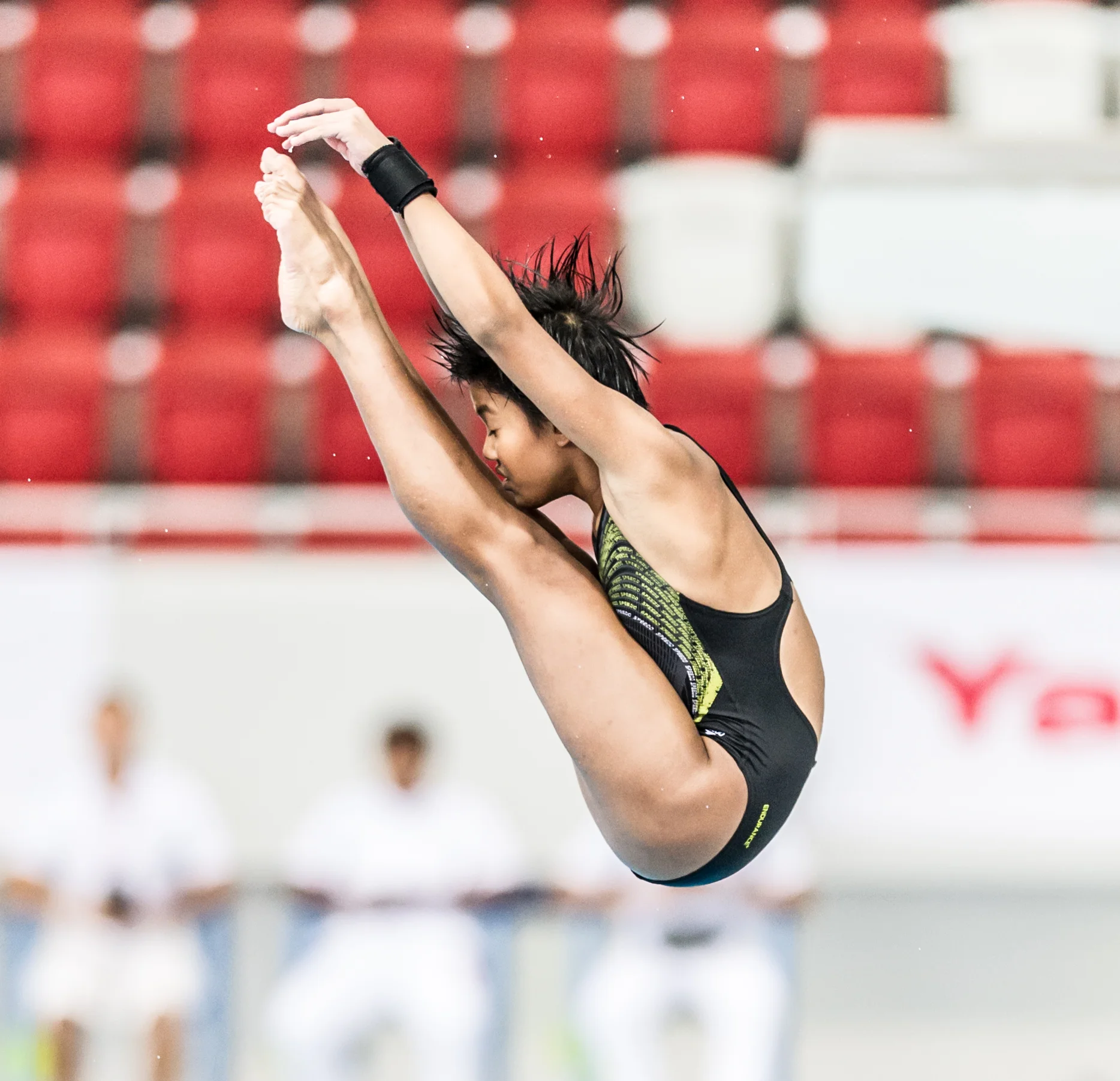 A diver rotates in the air during the Singapore National Diving Championships at the OCBC Aquatic Centre.