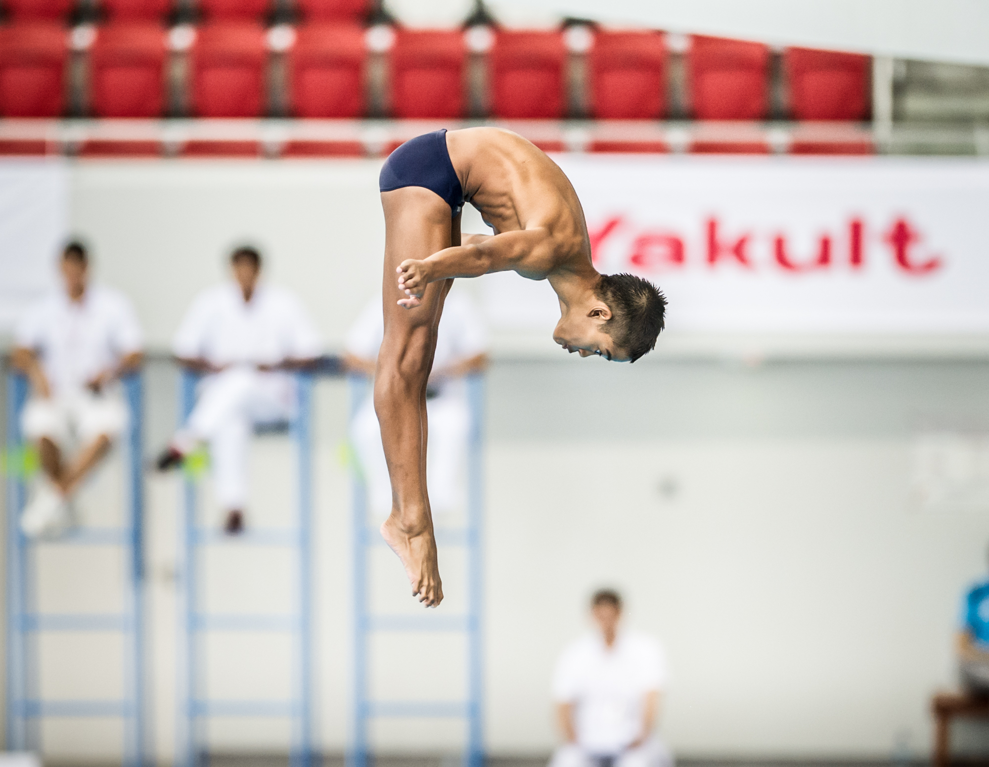 A Malaysian Diver rotates in the air during the Singapore National Diving Championships at the OCBC Aquatic Centre.