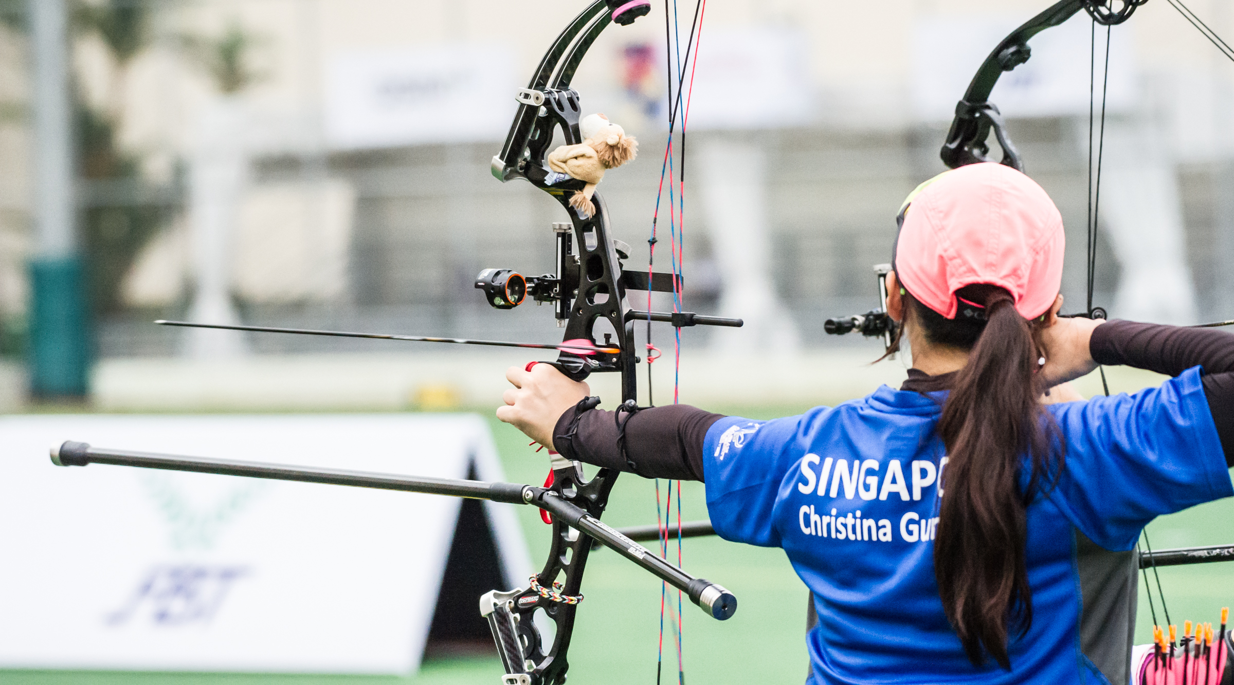 An arrow leaves the bow or an archer during the archery competition of the ASEAN University Games at the National Institute of Education.