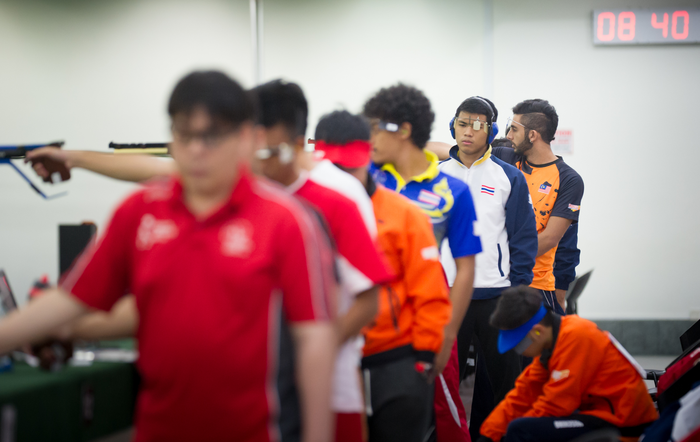 A Thai shooter recomposes himself during the shooting competition of the ASEAN University Games at Yishun SAFRA.