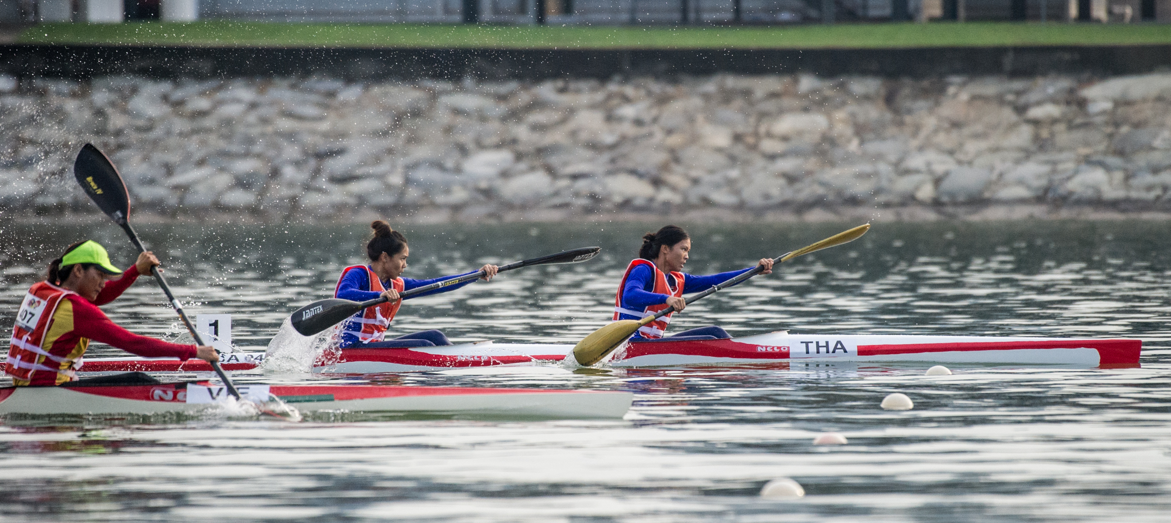 A Thai pair take an early lead in the Canoeing competition of the ASEAN University Games at the Marina Channel.