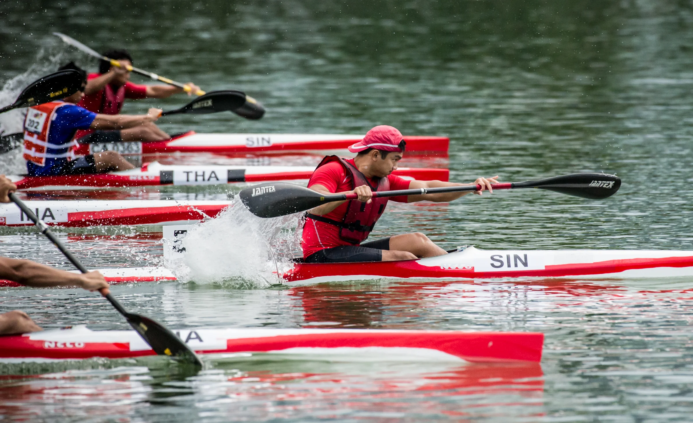 A Singaporean paddler takes an early lead in the Canoeing competition of the ASEAN University Games at the Marina Channel.