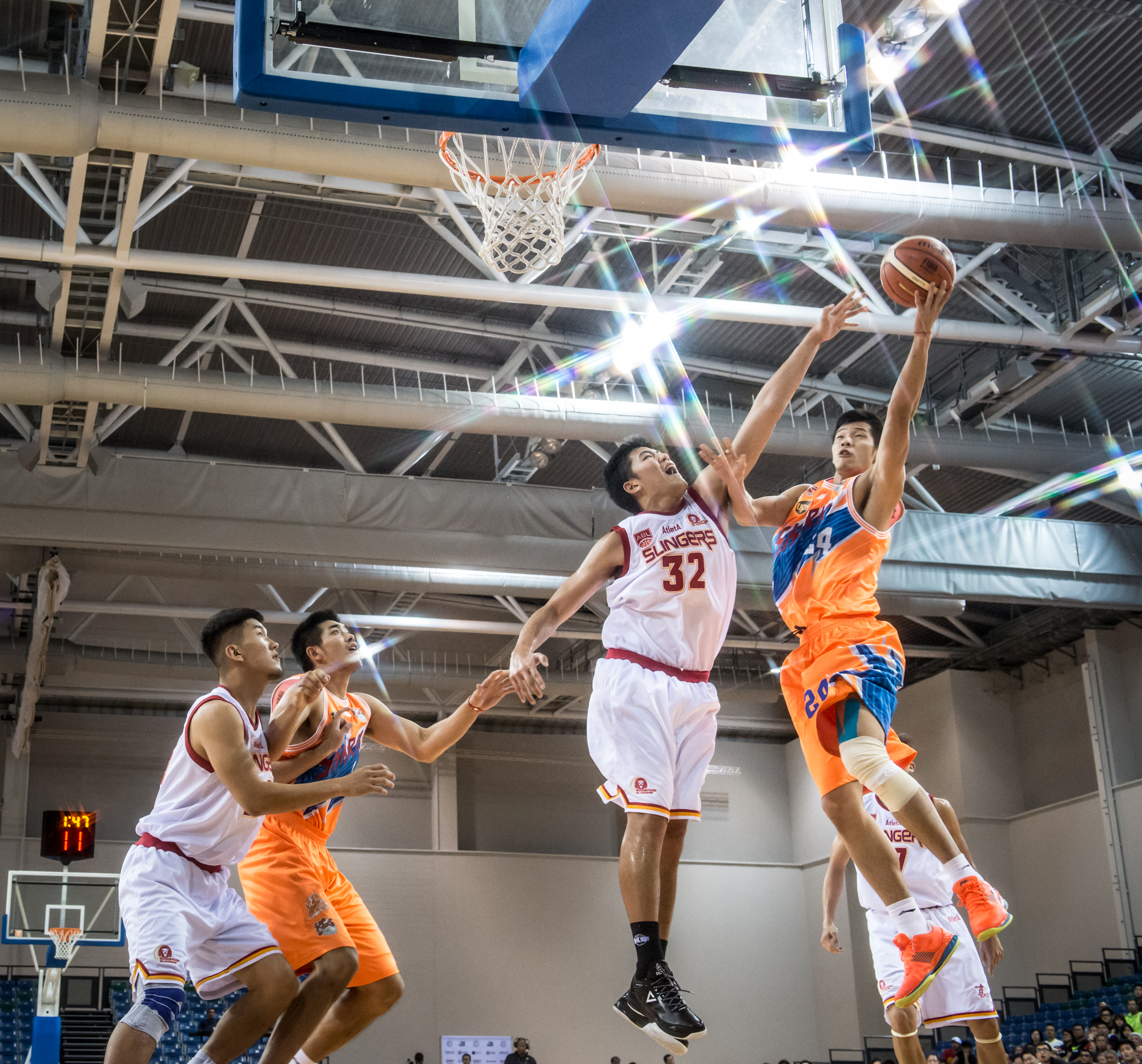 A Basketball player from China prepares to lay up during the Merlion Cup basketball competition at the OCBC Arena.